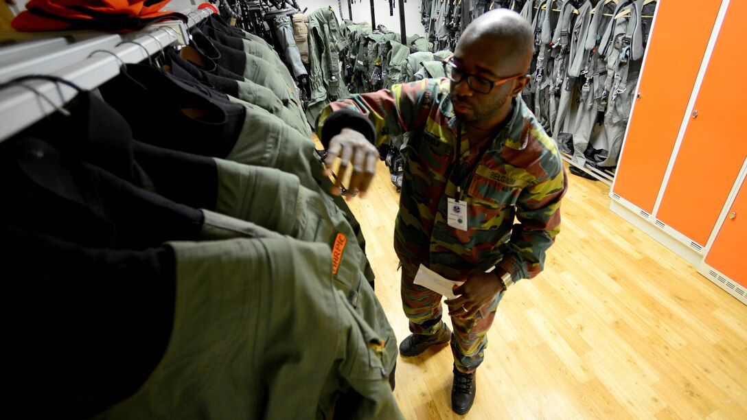 Belgian air force 1st Sgt. Emanuel, life support technician, prepares aircrew flight equipment, Feb. 29, 2016, at Bodø Main Air Station, Norway. The Belgian, U.S. and Norwegian air forces joined for the air operations portion of Exercise Cold Response 16—a maritime, land and air operations exercise to showcase NATO’s ability to defend against any threat in any environment. (U.S. Air Force photo by Staff. Sgt. R.J. Biermann/Released)