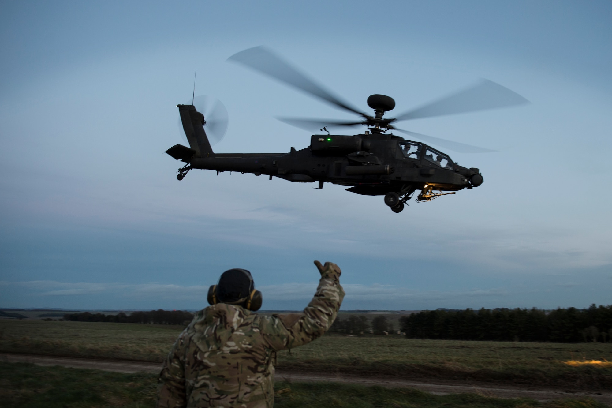 A British Army AH-64 Apache from 663 Squadron, 3 Regiment Army Air Corps, takes off during exercise Voijek Valour from Salisbury Plain, England, March 2, 2016. The exercise included six helicopters, 250 British soldiers and more than a dozen jets conducting scenarios across Salisbury Plain. (U.S. Air Force photo/Airman 1st Class Erin R. Babis)