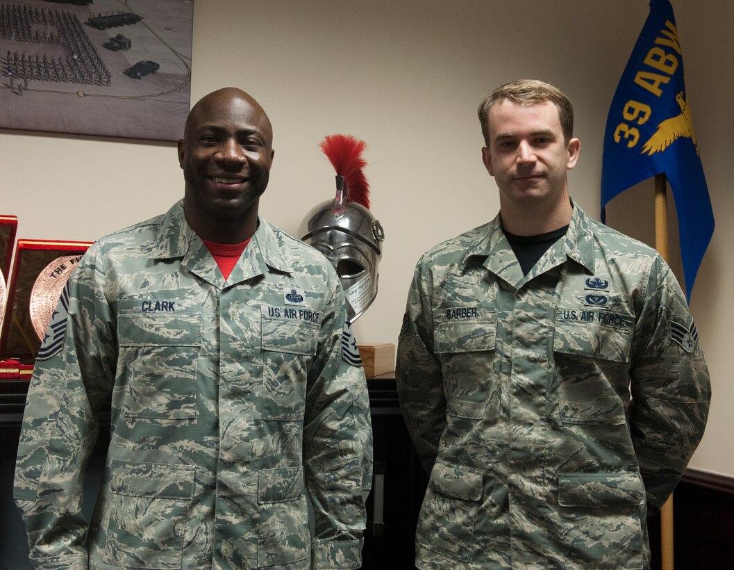 Chief Master Sgt. Vegas Clark, 39th Air Base Wing command chief, stands with Senior Airman Chad Barber, 39th Civil Engineer Squadron explosive ordnance technician, in the 39th ABW conference room before beginning Barber’s chief shadow day March 4, 2016. Airmen are chosen for the command chief’s shadow program based on their commander’s recommendation for their dedication to the mission. (U.S. Air Force photo by Tech. Sgt. Joshua Jasper/Released)