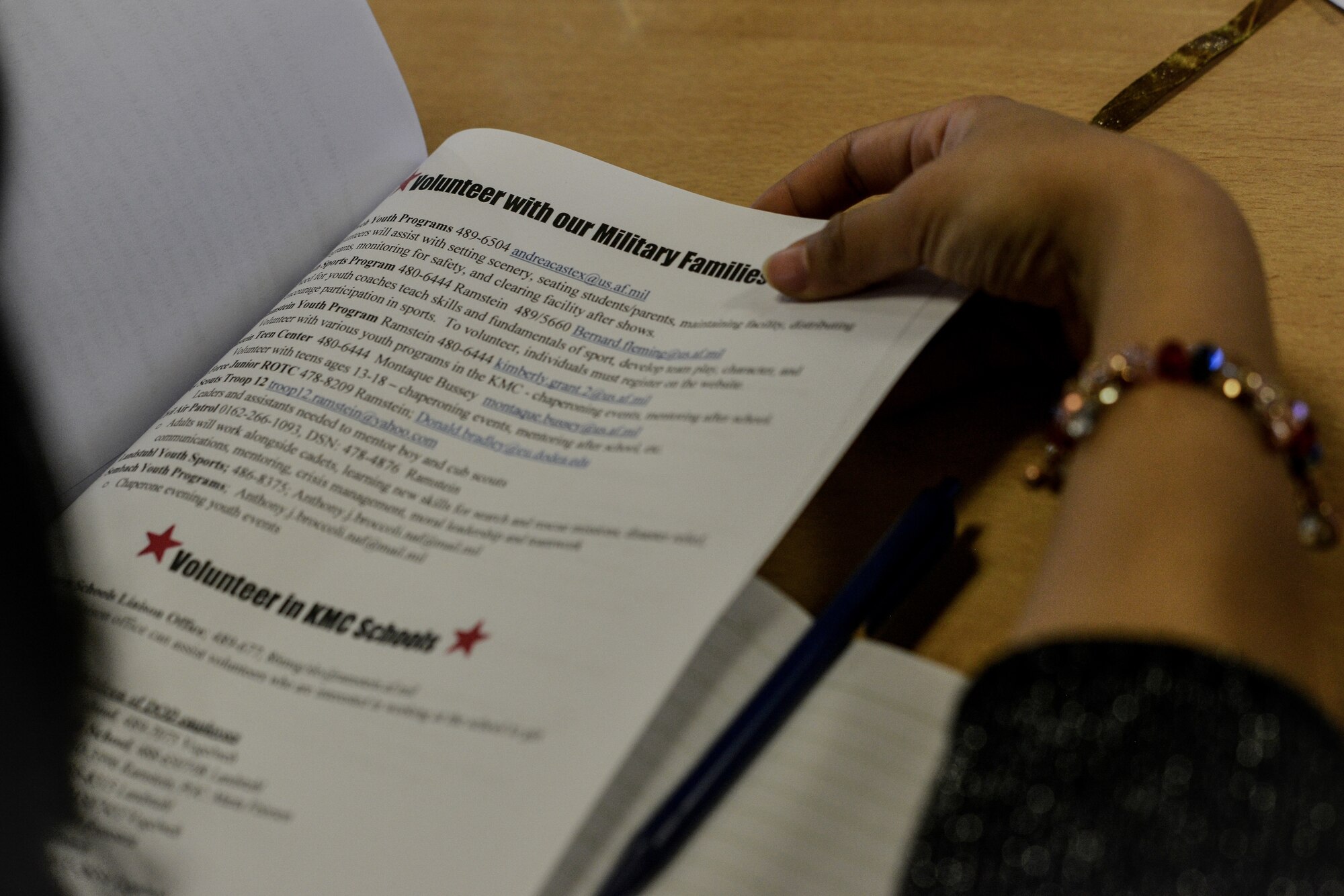 A participant reads through a brochure during the Ramstein Spouse Academy March 4, 2016, at Ramstein Air Base, Germany.  In an attempt to ease the stress of these many challenges of transitioning into a military lifestyle, the 86th Airlift Wing hosted the event which covered topics like child care, spouse life, careers and self-employment, volunteer opportunities and education. (U.S. Air Force photo/Senior Airman Nicole Sikorski) 