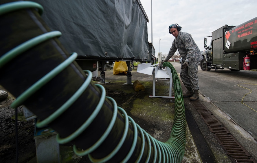 Tech. Sgt. Marcus Romero, 424th Air Base Squadron fuels management technician, stows a hose after refilling a fuel truck at Chièvres Air Base, Belgium, Feb. 25, 2016. Romero is one of 70 Airmen assigned to the 424th ABS. (U.S. Air Force photo/Staff Sgt. Sara Keller)