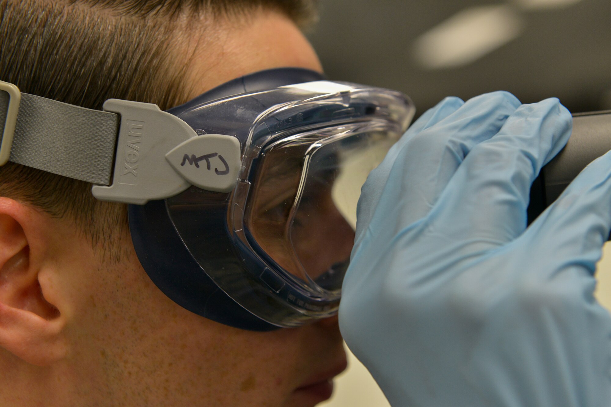 Senior Airman Matthew Jameson, 86th Logistics Readiness Squadron fuels laboratory technician, is looking through a refractometer to read the percentage of volume of fuel system icing inhibitor in a fuel sample during a lab test Mar. 3, 2016, at Ramstein Air Base, Germany. The new fuel laboratory tests samples of fuel to prevent bad fuel to damage engines of planes and vehicles and ensures the 86th Airlift Wing mission can continue. (U.S. Air Force photo/Airman 1st Class Lane T. Plummer)