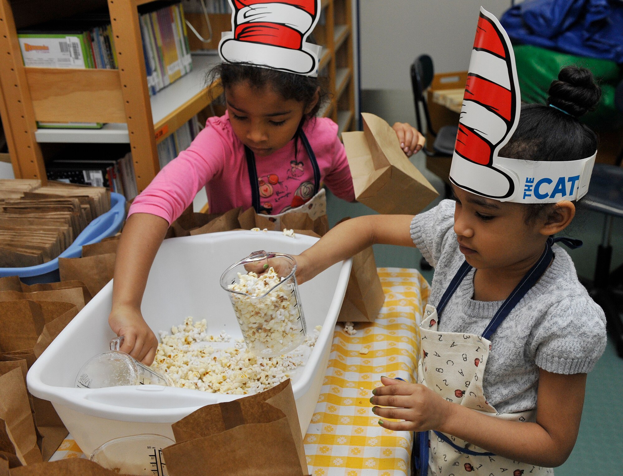 Ramstein Elementary School students fill up bags with popcorn during Read Across America week March 2, 2016, at Ramstein Air Base, Germany. This year, the Ramstein Elementary School staff planned a week full of activities for the students to enjoy and learn the importance of reading. (U.S. Air Force photo/Airman 1st Class Larissa Greatwood)