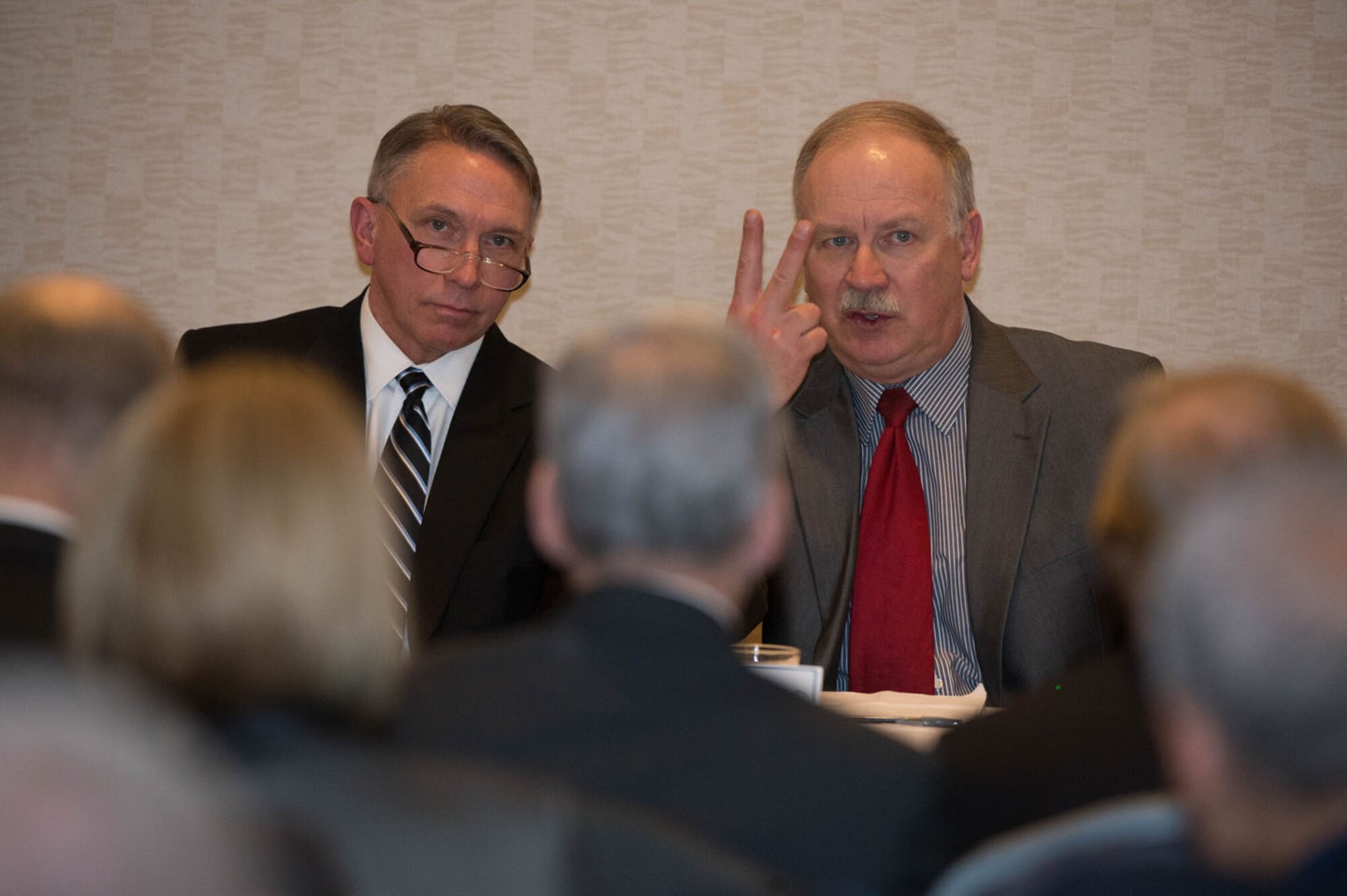 Bill Donaldson, Hanscom Small Business director, (on right), explains the small business
'Rule of Two' to attendees at an Air Force Life Cycle Management
Center-Hanscom Small Business Panel in Newton, Mass., March 2, while Scott
Kiser, Hanscom's director of Contracting, looks on. The 'Rule of Two,'which
is outlined in the Federal Acquisition Register, is a way to determine if a
small business set-aside is appropriate; there must be an expectation that
there will be at least two small businesses who are capable of doing the
work expected to bid, and at a fair market price.  (U.S. Air Force photo by
Jerry Saslav)

