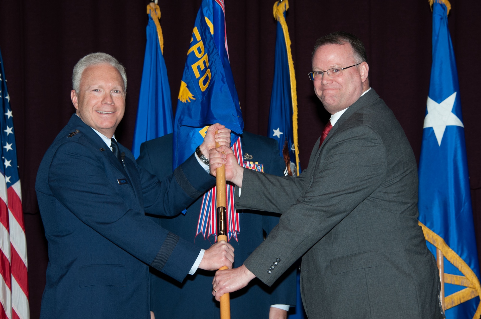 Maxwell AFB, Ala. -  The Air Force Materiel Command, Air Force Life Cycle Management Center held a Change of Leadership ceremony on Mar 3, 2016 at Maxwell AFB-Gnuter Annex, Alabama.  Lt. Gen. John Thompson, Commander, Air Force Life Cycle Management Center, Wright-Patterson AFB, Ohio officiated the ceremony where Mr. Robert Carl Shofner relinquished leadership and Mr. Richard Aldridge assumed leadership of the Business and Enterprise Systems Directorate, Maxwell AFB-Gunter Annex, Alabama.  The guidon bearer  was CMSgt Derrick Grames.  (US Air Force photo/Bud Hancock) 