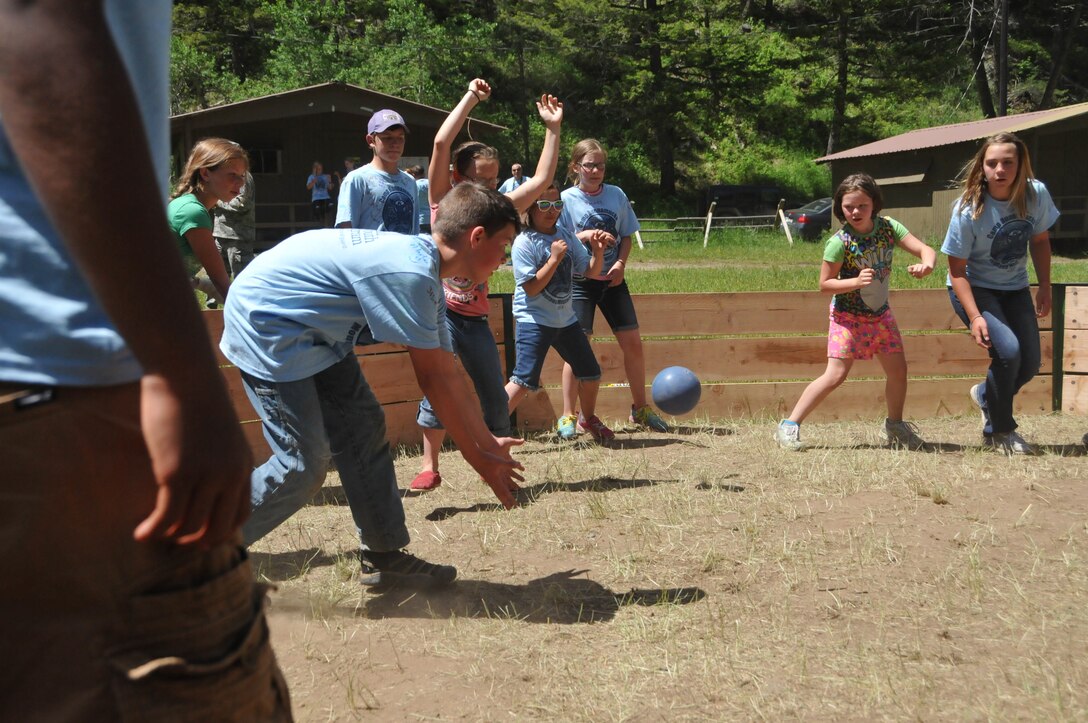 Campers play a form of dodge ball at Camp Runnamucka, located near Monarch, Mont. June 27, 2013. The camp is put on by the Montana National Guard Child and Youth Program and is intended to serve children of National Guard members who have deployed. (U.S. Air National Guard photo by Senior Master Sgt. Eric Peterson)