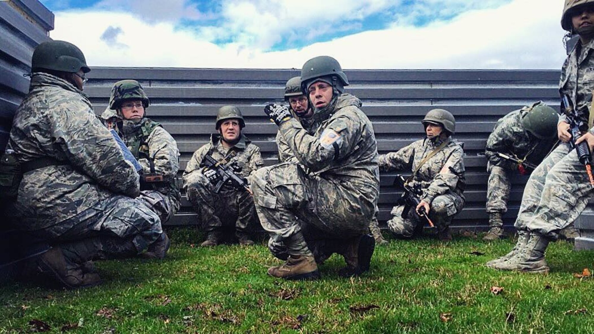 Airmen of the 120th Airlift Wing's Sustainment Flight take cover in a bunker following a simulated IED attack during the Silver Flag exercise force services combat training Feb. 20-26 at Dobbins Air Reserve Base, Ga. (U.S. Air National Guard photo by Master Sgt. Crystal Hoffman/Released)