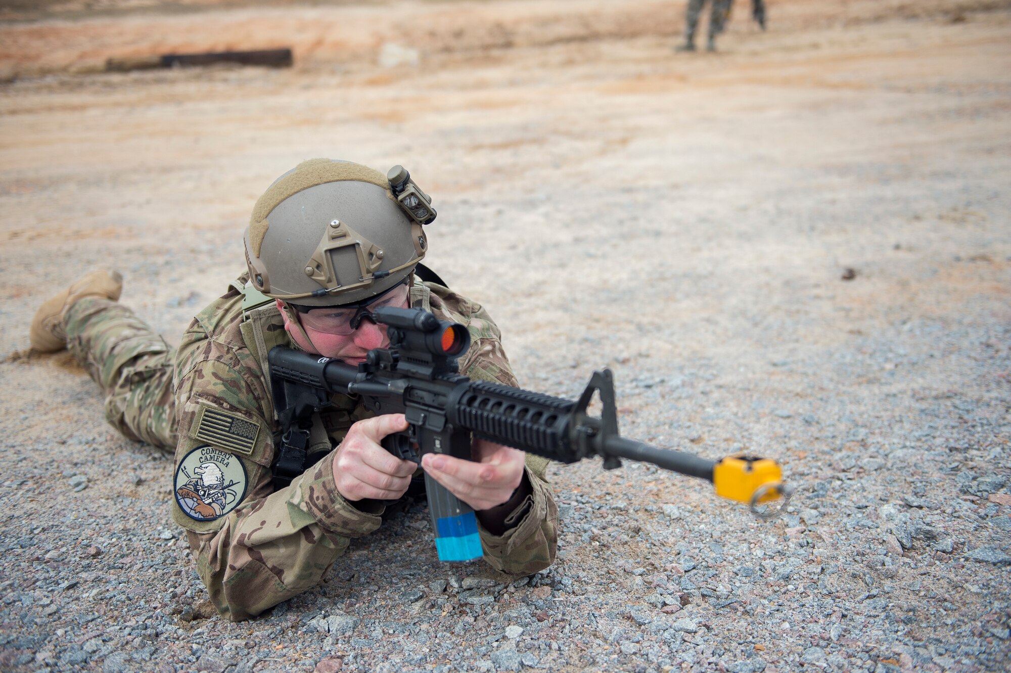 Staff Sgt. Jonathan Snyder, a combat photojournalist from the 3rd Combat Camera Squadron,  watches his sector March 3, 2016, during exercise Scorpion Lens 2016, at McCrady Training Center, Fort Jackson, South Carolina. The exercise is an annual training requirement incorporating combat camera job qualification standards and advanced weapons and tactical training with Army instructors. (U.S. Air Force photo/Staff Sgt. Jared Trimarchi)
