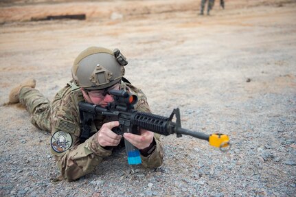 Staff Sgt. Jonathan Snyder, a combat photojournalist from the 3rd Combat Camera Squadron,  watches his sector March 3, 2016, during exercise Scorpion Lens 2016, at McCrady Training Center, Fort Jackson, South Carolina. The exercise is an annual training requirement incorporating combat camera job qualification standards and advanced weapons and tactical training with Army instructors. (U.S. Air Force photo/Staff Sgt. Jared Trimarchi)
