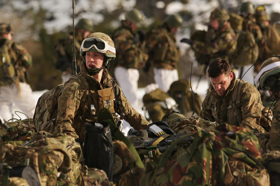 U.S. Marines and Dutch, British and Norwegian troops perform an integrated air insertion during Exercise Cold Response 16 near Namsos, Norway, March 3, 2016. The exercise aims to challenge the integration of air, land and sea capabilities of 13 NATO allies and partners while improving their collective capacity to respond and operate as a team. Marine Corps photo by Master Sgt. Chad McMeen
