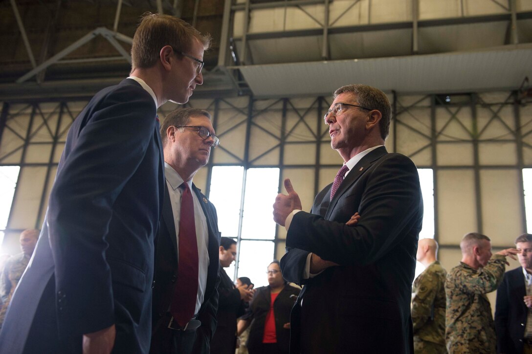 Defense Secretary Ash Carter meets with U.S. Reps. Denny Heck, center, and Derek Kilmer from Washington, during a visit to Joint base Lewis-McChord, Wash., March 4, 2016. DoD photo by Navy Petty Officer 1st Class Tim D. Godbee