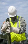 Pvt. Showan Isaacs, a cargo specialist with the 1174th Deployment and Distribution Battalion at Fort Totten, N.Y., inspects straps used to secure cargo during the Transmariner 2016 exercise in Military Ocean Terminal Sunny Point, N.C. During Transmariner, Army Reserve Soldiers receive, inspect, repackage and ready munitions for loading aboard vessels from Feb. 13 to May 21, 2016. (U.S. Army photo by Spc. Gregory Lydick/Released)