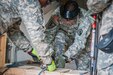 Spc. Miguel Toro, an ammunition specialist for the 266th Ordnance Company based in Aguadilla, Puerto Rico, bands a pallet of ammunition crates during Transmariner 2016 in Military Ocean Terminal Sunny Point, N.C., March 1. During Transmariner, Army Reserve Soldiers receive, inspect, repackage and ready munitions for loading aboard vessels from Feb. 13 to May 21. (U.S. Army photo by Sgt. Michael T. Crawford/RELEASED)