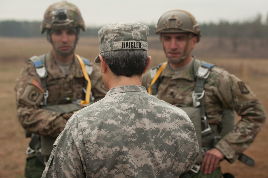 Brig. Gen. Janice M. Haigler, 335th Signal Command (Theater) Deputy Commanding General - Sustainment, speaks with U.S. Army Paratroopers from the 982nd Combat Camera Company (AIRBORNE), 335th SC (T), during Operation Glück ab!, at Fort Gordon, Ga., on March 4th, 2016. Operation Glück ab!, (OGA) is a bi-lateral airborne operation held at Fort Gordon, Ga., March 4, 2016. The purpose of OGA is to foster and nurture German and U.S. relationships, develop interoperability during training, and provide a basis for future operations in training and real world environments. The 982nd Combat Camera Company (Airborne), the 421st Quartermaster Company, and the United States Army Special Operations Command, Flight Company, Dwight D. Eisenhower Army Medical Center are providing support for OGA. (U.S. Army photo by Sgt. Jason A. Young / Released)