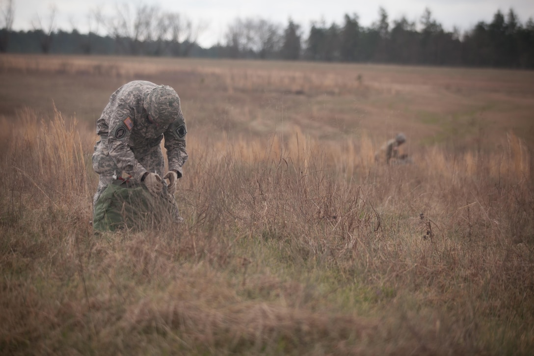 U.S. Army Paratroopers recover their equipment during Operation Glück ab!, at Fort Gordon, Ga., on March 4th, 2016. Operation Glück ab!, (OGA) is a bi-lateral airborne operation held at Fort Gordon, Ga., March 4, 2016. The purpose of OGA is to foster and nurture German and U.S. relationships, develop interoperability during training, and provide a basis for future operations in training and real world environments. The 982nd Combat Camera Company (Airborne), the 421st Quartermaster Company, and the United States Army Special Operations Command, Flight Company, Dwight D. Eisenhower Army Medical Center are providing support for OGA. (U.S. Army photo by Sgt. Jason A. Young / Released)