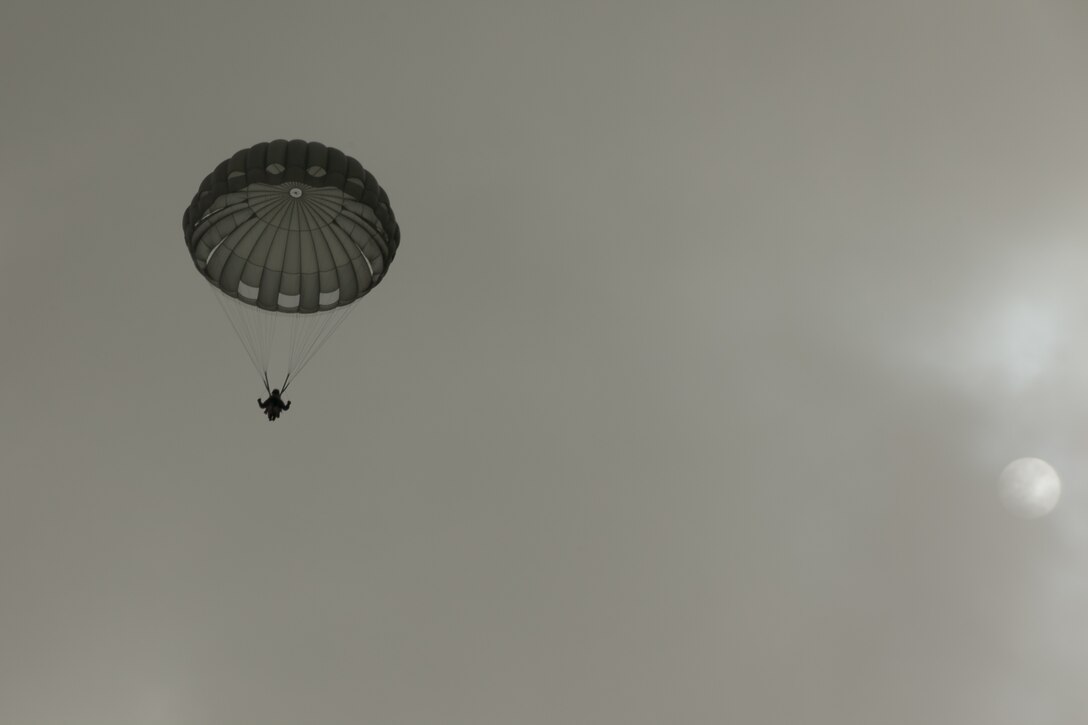 U.S. Army Paratrooper prepares to land during Operation Glück ab!, at Fort Gordon, Ga., on March 4th, 2016. Operation Glück ab!, (OGA) is a bi-lateral airborne operation held at Fort Gordon, Ga., March 4, 2016. The purpose of OGA is to foster and nurture German and U.S. relationships, develop interoperability during training, and provide a basis for future operations in training and real world environments. The 982nd Combat Camera Company (Airborne), the 421st Quartermaster Company, and the United States Army Special Operations Command, Flight Company, Dwight D. Eisenhower Army Medical Center are providing support for OGA. (U.S. Army photo by Sgt. Jason A. Young / Released)