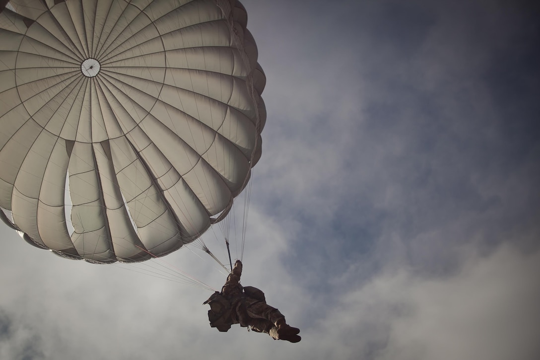 U.S. Army Paratrooper prepares to land during Operation Glück ab!, at Fort Gordon, Ga., on March 4th, 2016. Operation Glück ab!, (OGA) is a bi-lateral airborne operation held at Fort Gordon, Ga., March 4, 2016. The purpose of OGA is to foster and nurture German and U.S. relationships, develop interoperability during training, and provide a basis for future operations in training and real world environments. The 982nd Combat Camera Company (Airborne), the 421st Quartermaster Company, and the United States Army Special Operations Command, Flight Company, Dwight D. Eisenhower Army Medical Center are providing support for OGA. (U.S. Army photo by Sgt. Jason A. Young / Released)