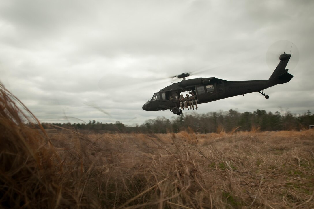 U.S. Army Paratroopers take off in UH-60  Black Hawk during Operation Glück ab!, at Fort Gordon, Ga., on March 4th, 2016. Operation Glück ab!, (OGA) is a bi-lateral airborne operation held at Fort Gordon, Ga., March 4, 2016. The purpose of OGA is to foster and nurture German and U.S. relationships, develop interoperability during training, and provide a basis for future operations in training and real world environments. The 982nd Combat Camera Company (Airborne), the 421st Quartermaster Company, and the United States Army Special Operations Command, Flight Company, Dwight D. Eisenhower Army Medical Center are providing support for OGA. (U.S. Army photo by Sgt. Jason A. Young / Released)