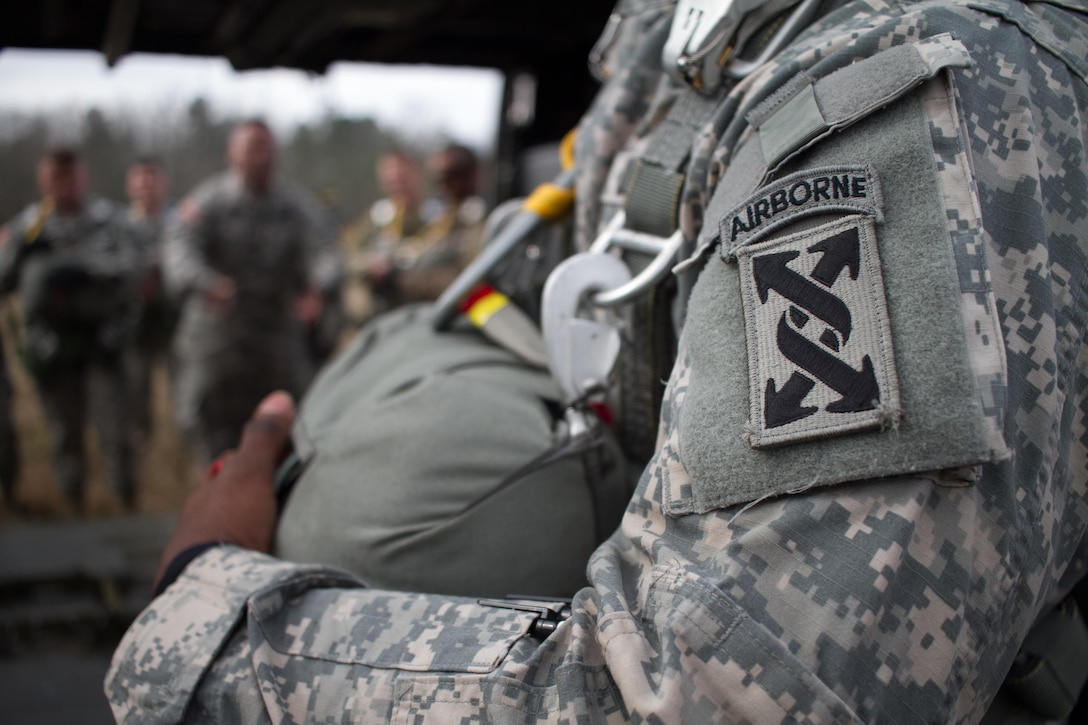 U.S. Army Paratroopers receive a brief of the UH-60 Black Hawk during Operation Glück ab!, at Fort Gordon, Ga., on March 4th, 2016. Operation Glück ab!, (OGA) is a bi-lateral airborne operation held at Fort Gordon, Ga., March 4, 2016. The purpose of OGA is to foster and nurture German and U.S. relationships, develop interoperability during training, and provide a basis for future operations in training and real world environments. The 982nd Combat Camera Company (Airborne), the 421st Quartermaster Company, and the United States Army Special Operations Command, Flight Company, Dwight D. Eisenhower Army Medical Center are providing support for OGA. (U.S. Army photo by Sgt. Jason A. Young / Released)