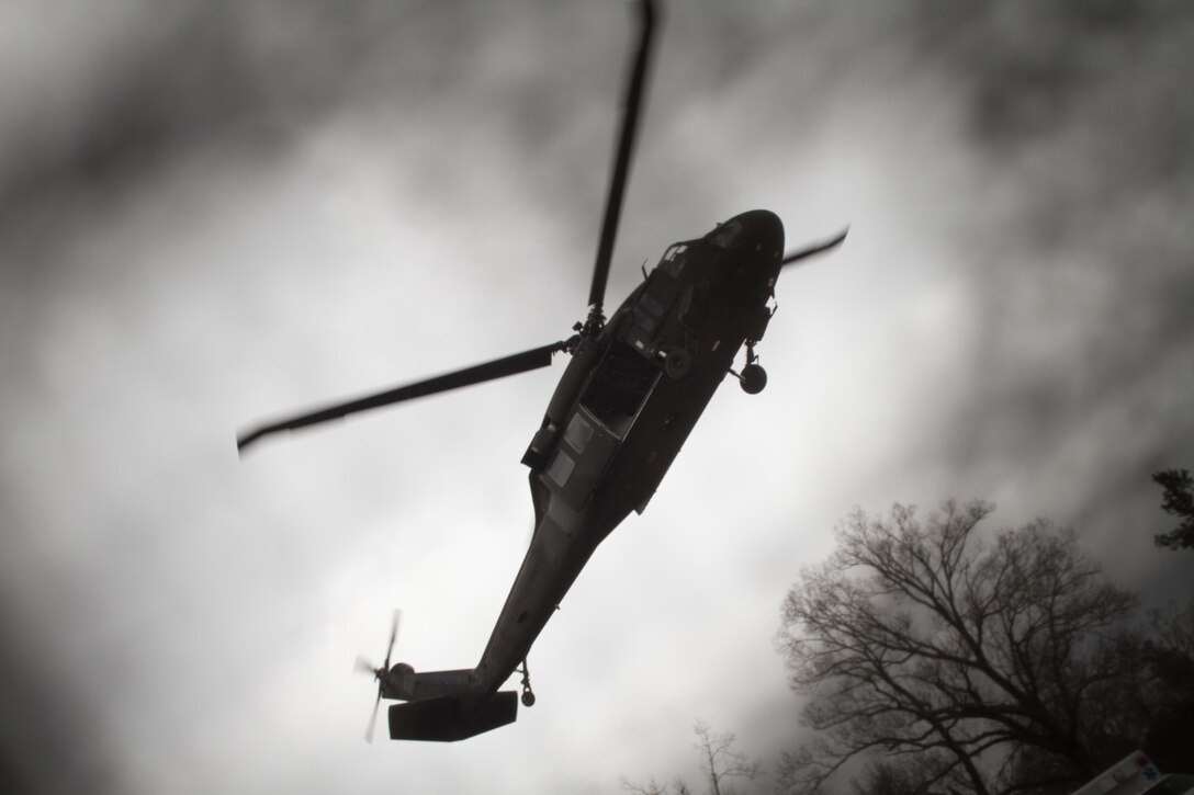 UH-60 Black Hawk prepares to land during Operation Glück ab!, at Fort Gordon, Ga., on March 4th, 2016. Operation Glück ab!, (OGA) is a bi-lateral airborne operation held at Fort Gordon, Ga., March 4, 2016. The purpose of OGA is to foster and nurture German and U.S. relationships, develop interoperability during training, and provide a basis for future operations in training and real world environments. The 982nd Combat Camera Company (Airborne), the 421st Quartermaster Company, and the United States Army Special Operations Command, Flight Company, Dwight D. Eisenhower Army Medical Center are providing support for OGA. (U.S. Army photo by Sgt. Jason A. Young / Released)