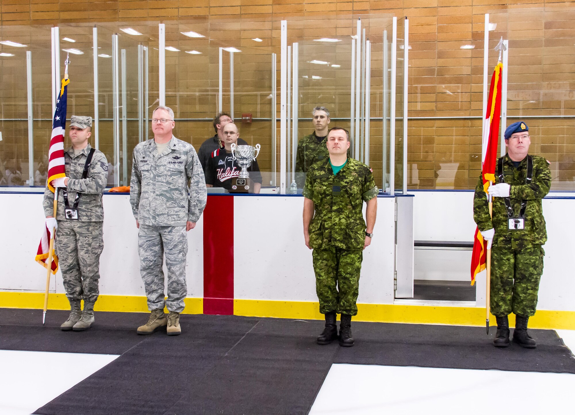 Col. William Krueger, Western Air Defense Sector vice commander and Lt. Col. Matthew Wappler, Canadian Detachment commander, prepare for the start of the 22nd annual Canuck USA Hockey Classic. WADS is responsible for air sovereignty and counter-air operations over the western United States and directs a variety of assets to defend 2.2 million square miles of land and sea. The event has been a classic team building event for U.S. and Canada, whose airmen work side by side every day.(Courtesy photo by Conrad Neumann III)