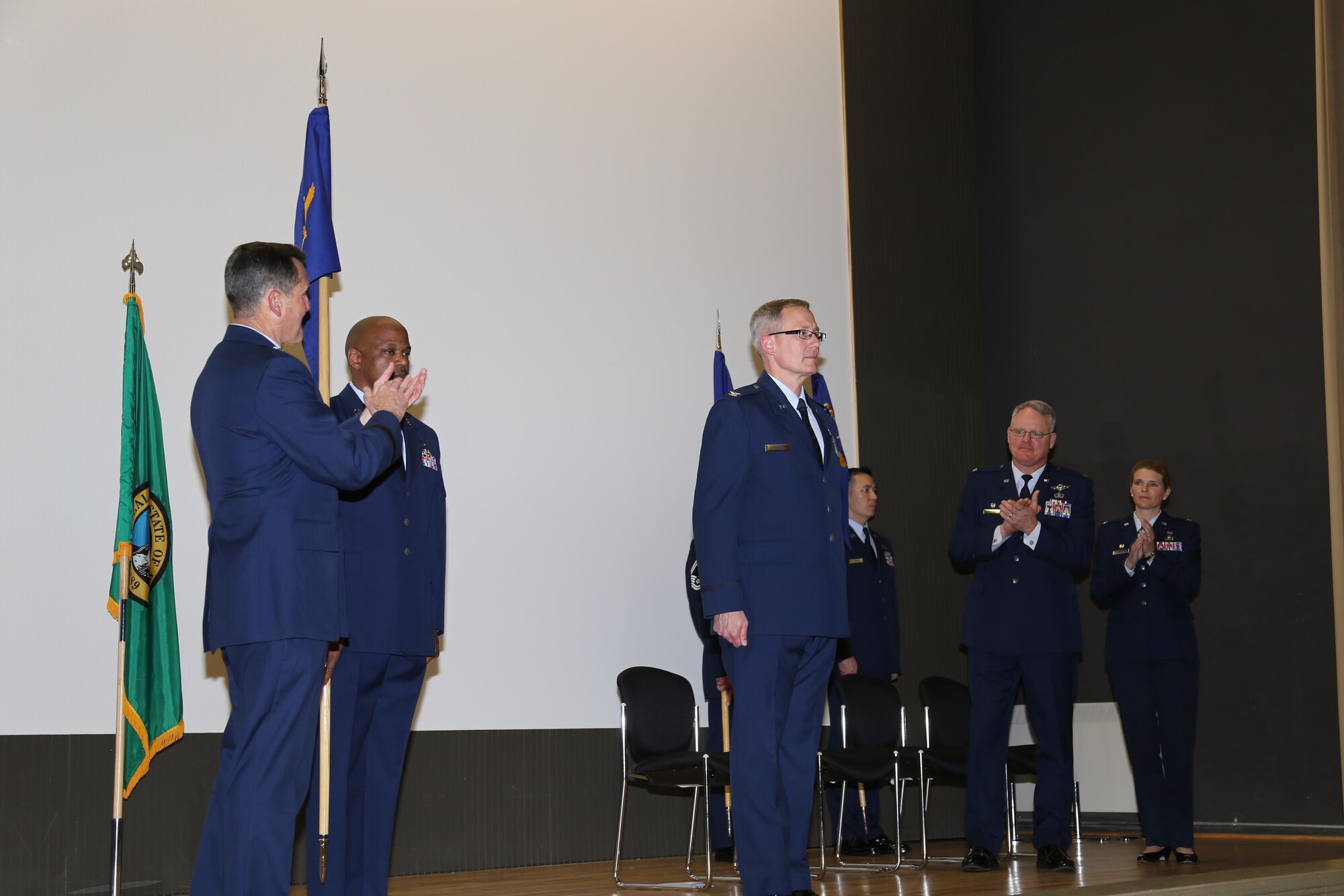 Western Air Defense Sector, newly appointed 225th Air Defense Group Commander, Col. Ronald D. Harmon, receives applause after his official assumption, Joint Base Lewis-McChord, May 2, 2015. WADS is responsible for air sovereignty and counter-air operations over the western United States and directs a variety of assets to defend 2.2 million square miles of land and sea. (U.S. Air National Guard photo by Capt. Kimberly Burke/Released)
