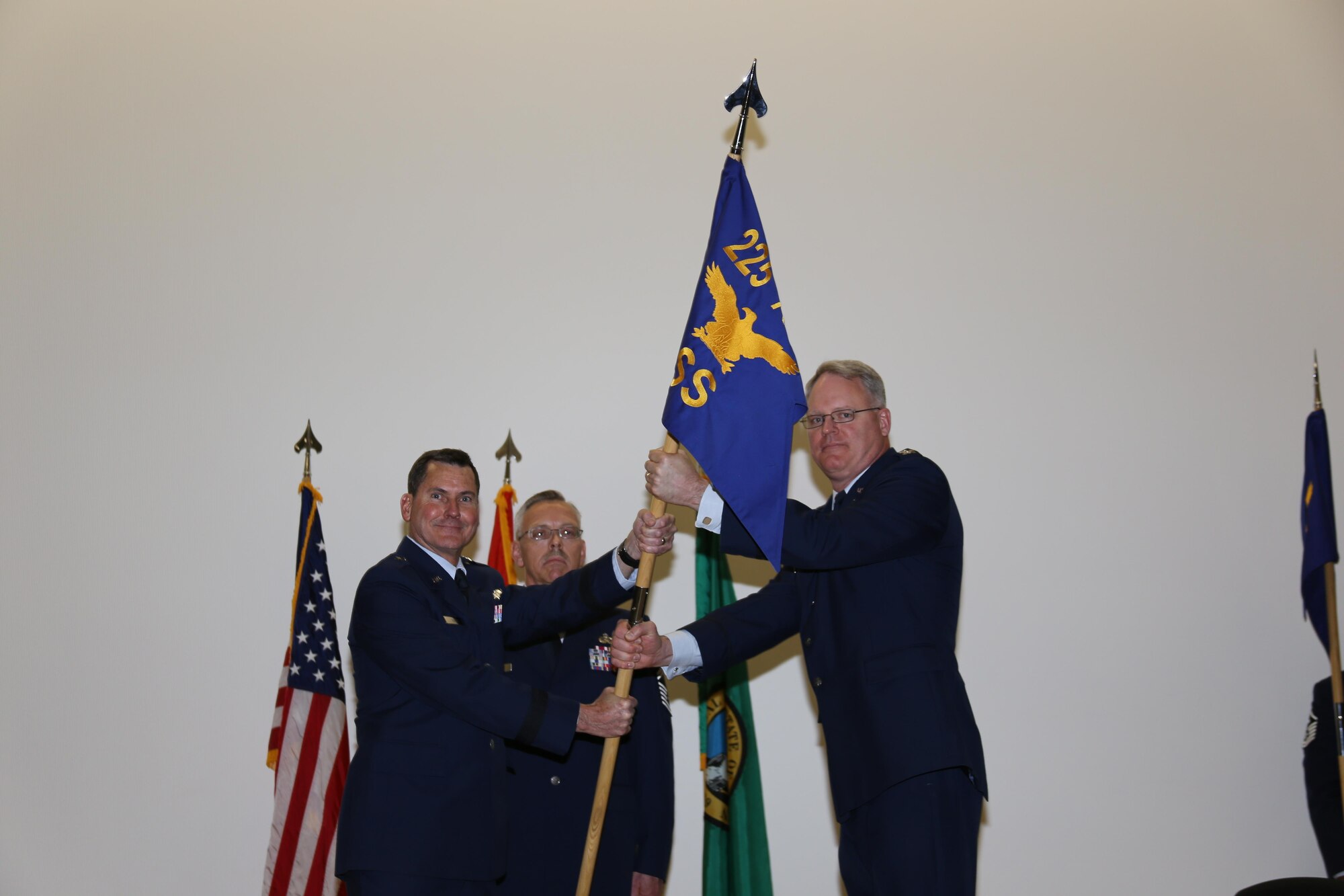 Western Air Defense Sector, Director of Support, Col. William A. Krueger, receives the 225 Support Squadron guideon from Brig. Gen. John S. Tuohy, Washington state assistant adjutant general - Air, during the activation and assumption of command ceremony, Joint Base Lewis-McChord, May 2, 2015. WADS is responsible for air sovereignty and counter-air operations over the western United States and directs a variety of assets to defend 2.2 million square miles of land and sea. (U.S. Air National Guard photo by Capt. Kimberly Burke/Released)