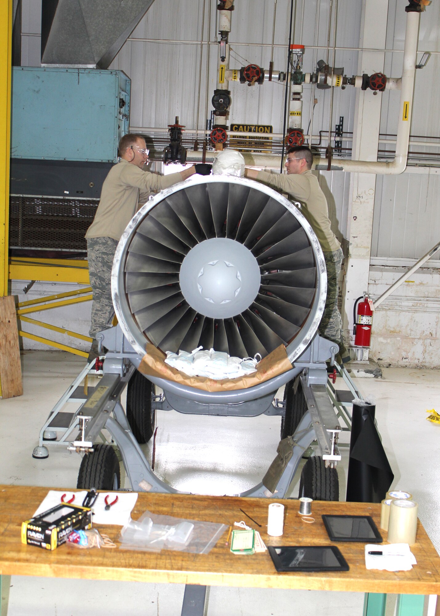 Tech. Sgt. Richard Coleman and Tech. Sgt. Andrew Rudolph prepare a jet engine for shipment, March 5, 2016. Coleman and Rudolph are both aerospace propulsion specialists with the 127th Maintenance Squadron at Selfridge Air National Guard Base. (U.S. Air National Guard photo by Tech. Sgt. Dan Heaton)