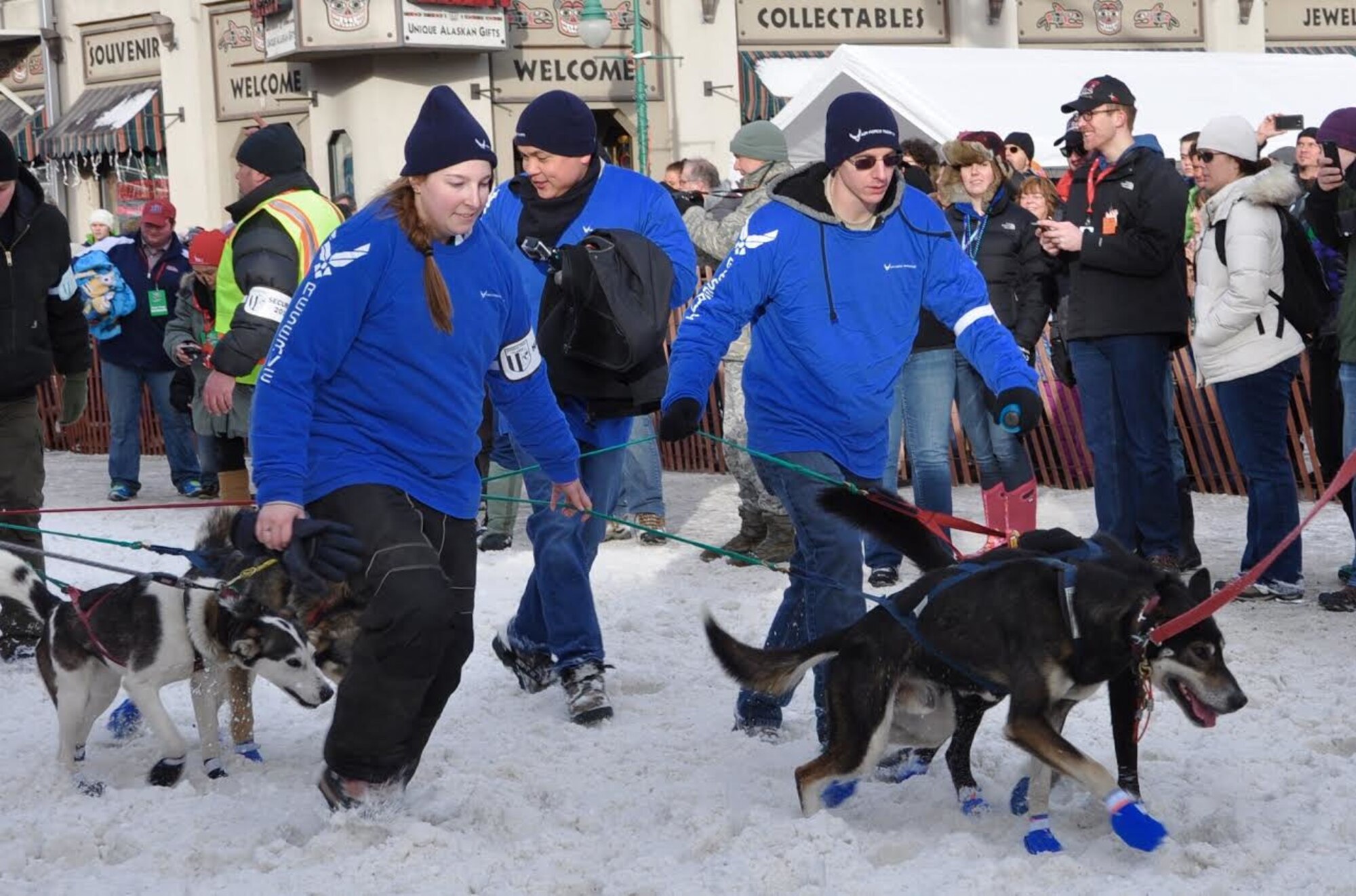 Senior Airman Sean Buono, 477th Force Support Squadron, client systems technician, Tech. Sgt. Franz Martinez,  477th FG FSS, client systems technician and Jacki Honeycutt, daughter of Chief Master Sgt. Horace Honeycutt, 477th Chief Enlisted Manager volunteered as a dog handler for an Iditarod team during the ceremonial start in Anchorage, Alaska March 5.  For the second year in a row the Air Force Reserve is a Lead Dog Sponsor for the Iditarod Race, known as The Last Great Race on Earth. The Iditarod is a 1,000-mile sled dog race across the rugged terrain of Alaska. (U.S. Air Force / Tech. Sgt. Kimberly Rae Moore)
