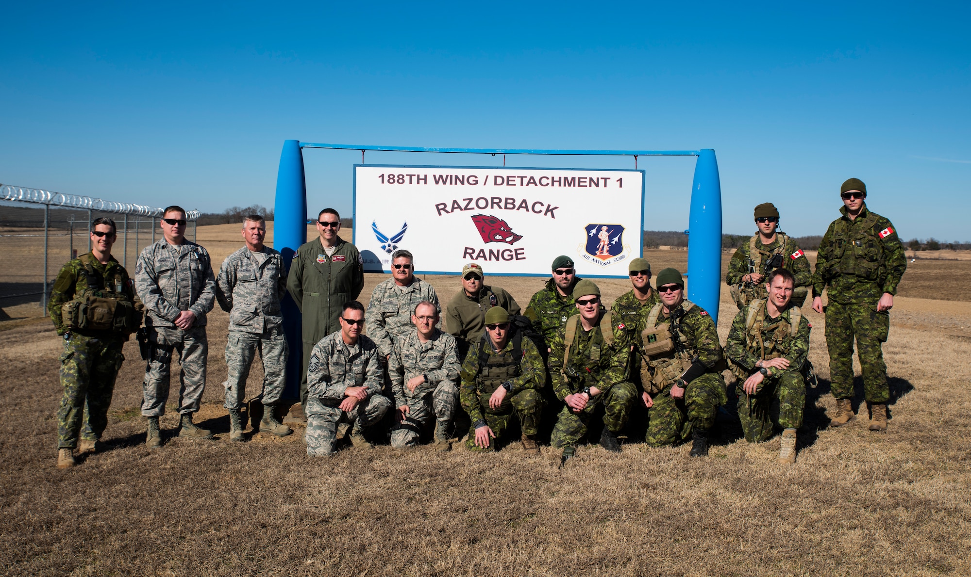 Airmen of the 188th Wing and members of the 2nd Regiment Royal Canadian Horse Artillery gather together as a group Feb. 10, 2016, during training held at Razorback Range, Fort Chaffee Joint Maneuver Training Center, Fort Smith, Ark. Canadian JTACs are required to train abroad at least twice a year and chose to come to Razorback Range to benefit from the wealth of training opportunities provided there. (U.S. Air National Guard photo by Senior Airman Cody Martin/Released) 