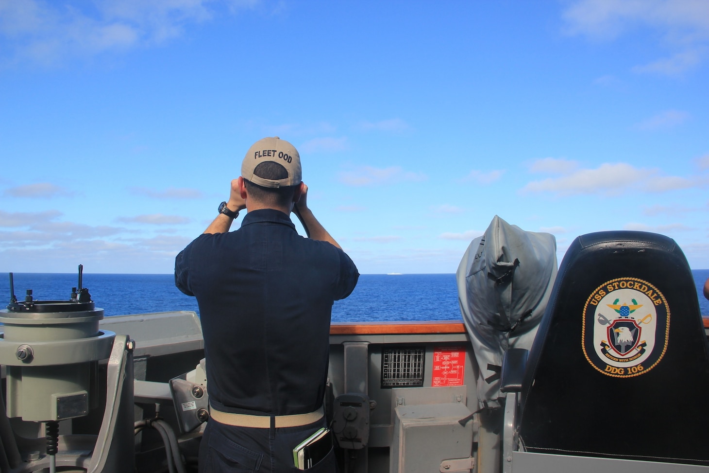 160305-N-ZZ999-041
SOUTH CHINA SEA (Mar. 05, 2016) – USS Stockdale’s (DDG 106) officer of the deck scans the horizon for other surface vessels during a routine patrol in the South China Sea.  Providing a ready force supporting security and stability in the Indo-Asia-Pacific, Stockdale is operating as part of the John C. Stennis Strike Group and Great Green Fleet on a regularly scheduled 7th Fleet deployment. (U.S. Navy photo by Ensign Molly Hanna /Unreleased)