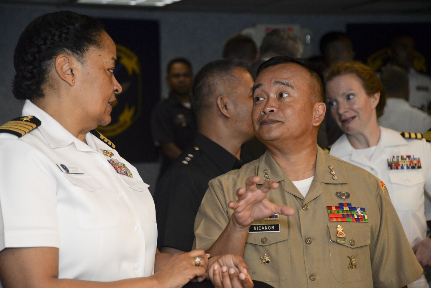 130305-N-CZ848-021 MANILA, Philippines (Mar. 5, 2016) – Captain Timika Lindsay, left, the Assistant Chief of Staff for C7F Communications Systems Information Officer, and Col. Eric Nicanor, her Philippine counterpart, have a conversation during bilateral talks held aboard USS Blue Ridge (LCC 19), in Manila Philippines. The bilateral talks between the U.S. and Philippine navies are being held to enhance cooperation and strengthen relationships to best provide security and stability in the Indo-Asia Pacific. (U.S. Navy photo by Mass Communication Specialist 2nd Class Jason Kofonow/Released)