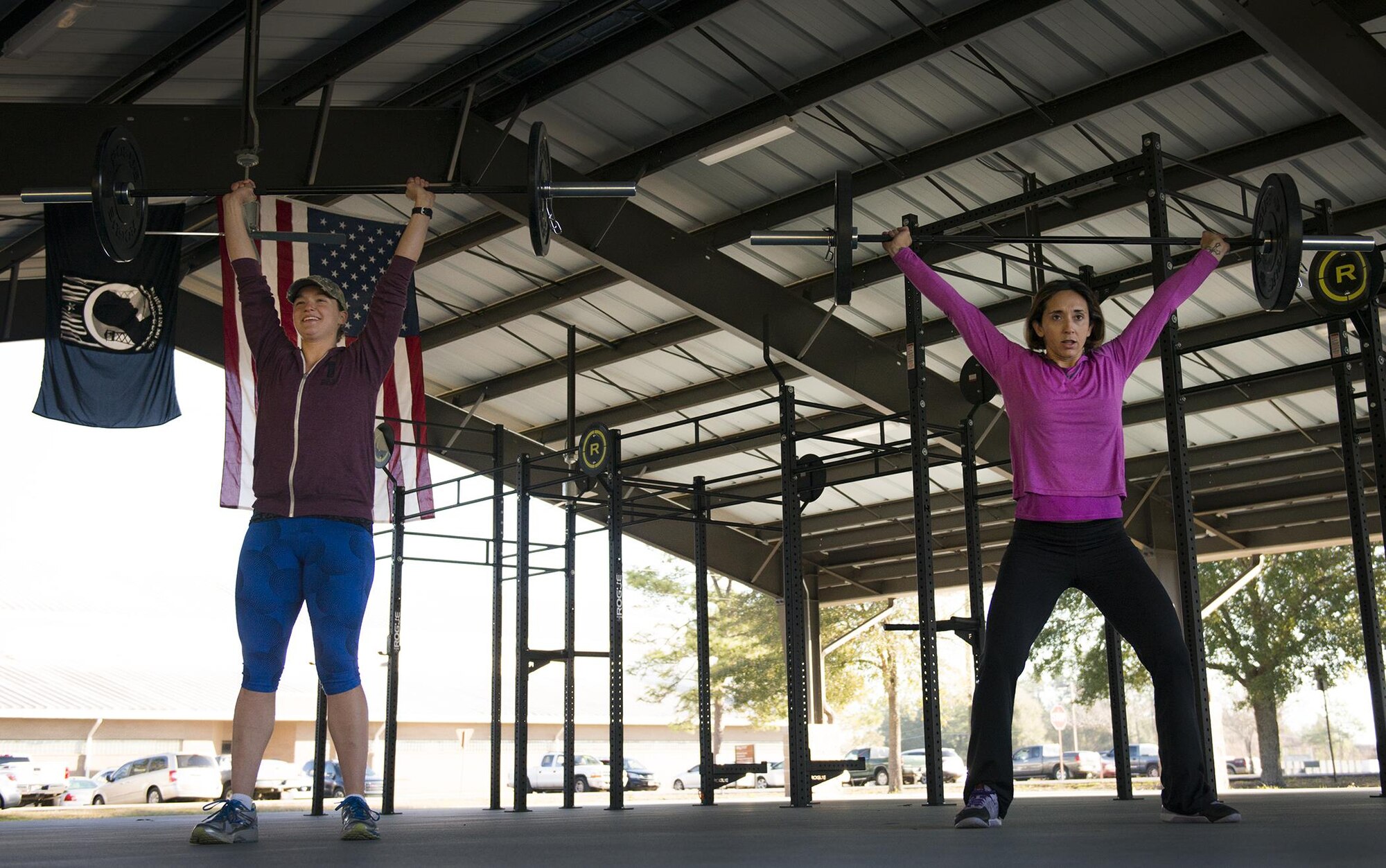 Capt.s Susan Frank, 919th Special Operations Logistics Readiness Squadron and Linda McCullough, 919th Special Operations Maintenance Group lift weights during their workout March 6 at Duke Field Fla.  The captains recently competed in the Blue Collar Beat Down competition and placed first overall against 10 other teams.  (U.S. Air Force photo/Tech. Sgt. Sam King)