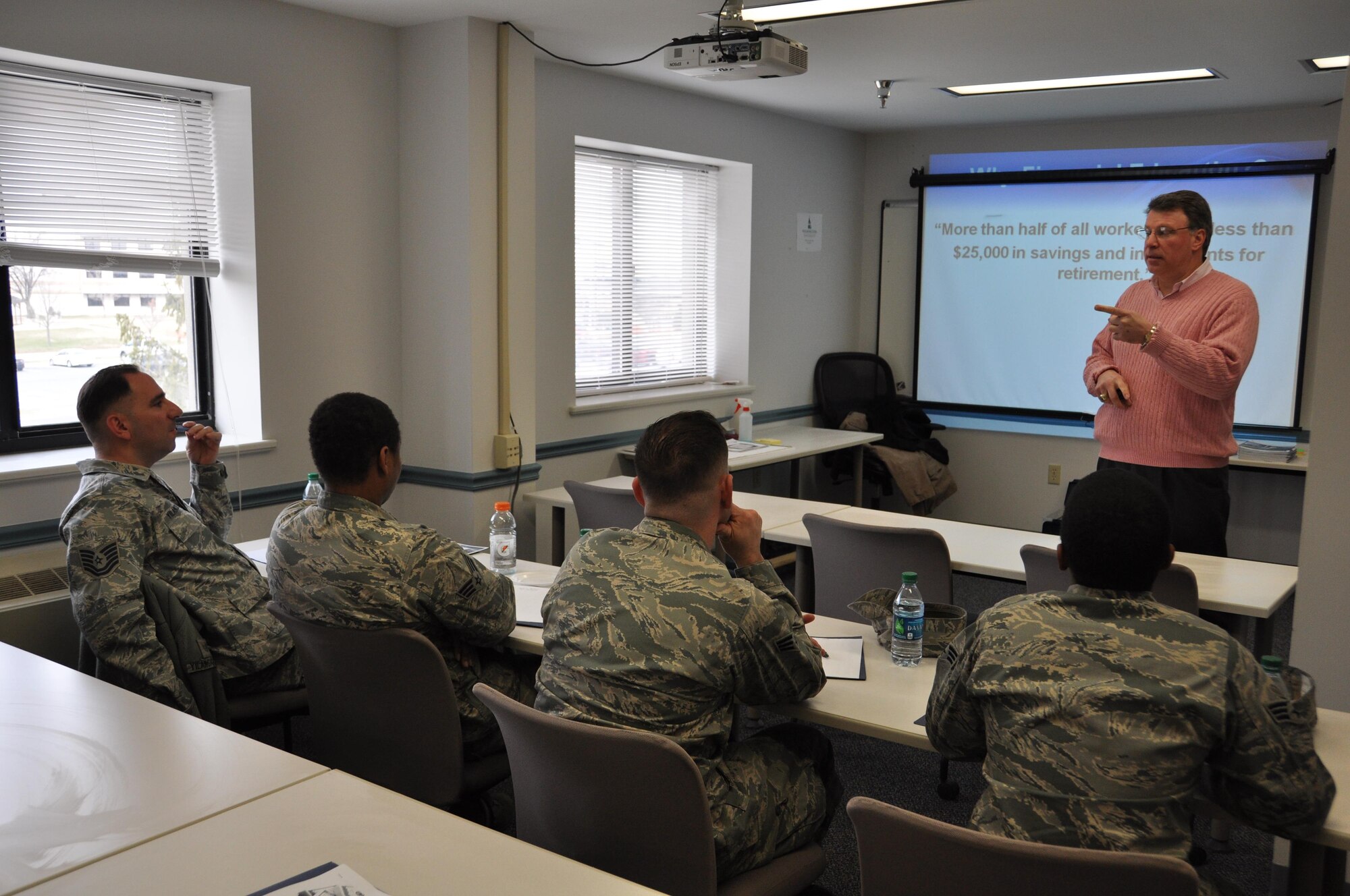 Rod Hausmann, financial management representative with the Delaware Financial Literacy Institute, answers a question about smart investment practices March 5, 2016 at Dover Air Force Base, Delaware. Hausmann moderated a Financial Fitness seminar for 512th Airlift Wing Airmen to discuss a variety of topics, from managing assets to reducing personal debt, to helping reservists plan for a more secure financial future. (U.S. Air Force photo/Staff Sgt. Joe Yanik) 
