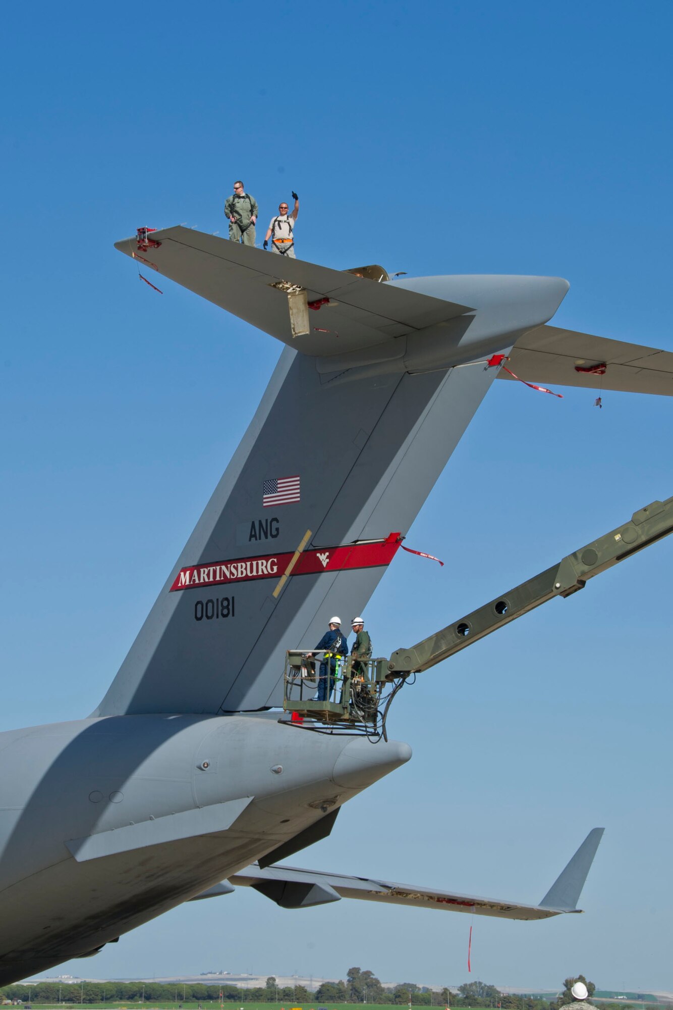 Tech. Sgt. Dave Wilde (upper left), 446th Aircraft Maintenance Squadron hydraulic technician, and Tech. Sgt. Francis Aguon (upper right), 446th AMXS crew chief, replace an integrative flight control module on a C-17 Globemaster III at Naval Station Rota, Spain February 23, 2016. The IFCM was replaced because of slow control surface movement. (U.S. Air Force Reserve photo by Staff Sgt. Madelyn McCullough)