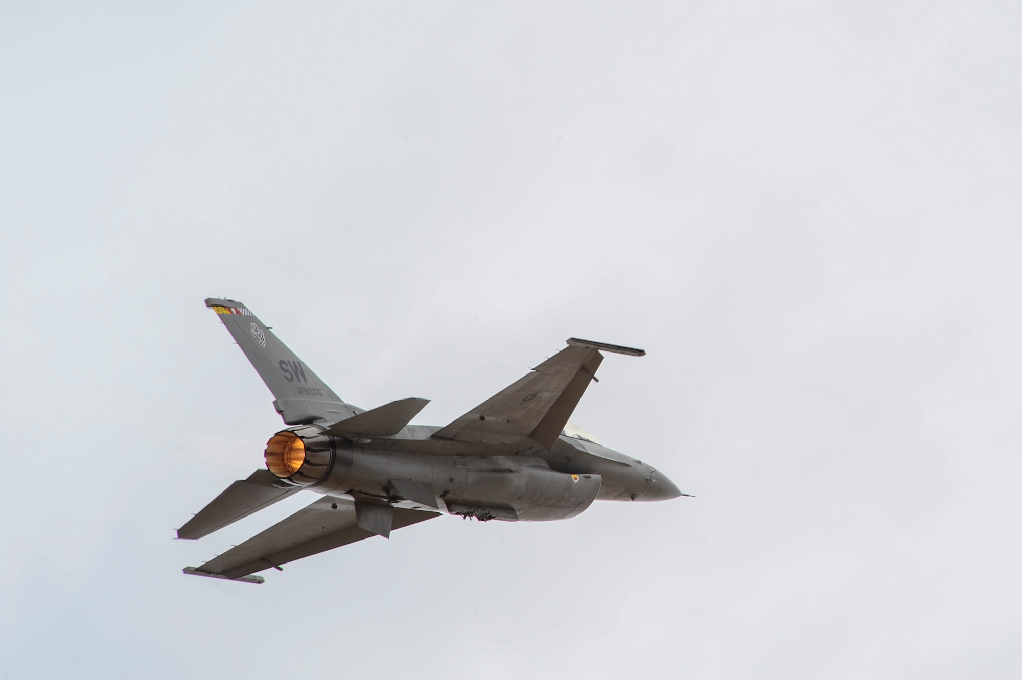 An F-16C Fighting Falcon performs areal demonstrations during the 2016 Heritage Flight Training and Certification Course at Davis-Monthan Air Force Base, Ariz., March 6, 2016. The F-16 Fighting Falcon is a compact, multi-role fighter aircraft. It is highly maneuverable and has proven itself in air-to-air combat and air-to-surface attack. (U.S. Air Force photo by Airman 1st Class Mya M. Crosby/Released)