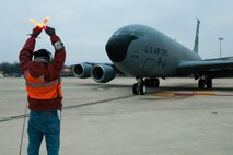 Master Sgt. Frank Perna, 459th Aircraft Maintenance Squadron crew chief, directs a KC-135R Stratotanker to stop on the Joint Base Andrews, Md., flight line March 4, 2016. The aircraft transported Sen. John Boozman, members of the Air Force Caucus and Congressional staff back to the National Capital Region from Moody Air Force Base, Ga., where the senator, members of the Air Force Caucus and other Congressional staff attended an air power demonstration. The demonstration included precision attack, personnel recovery, combat search and rescue and refueling operations. (U.S. Air Force photo by Staff Sgt. Kat Justen)