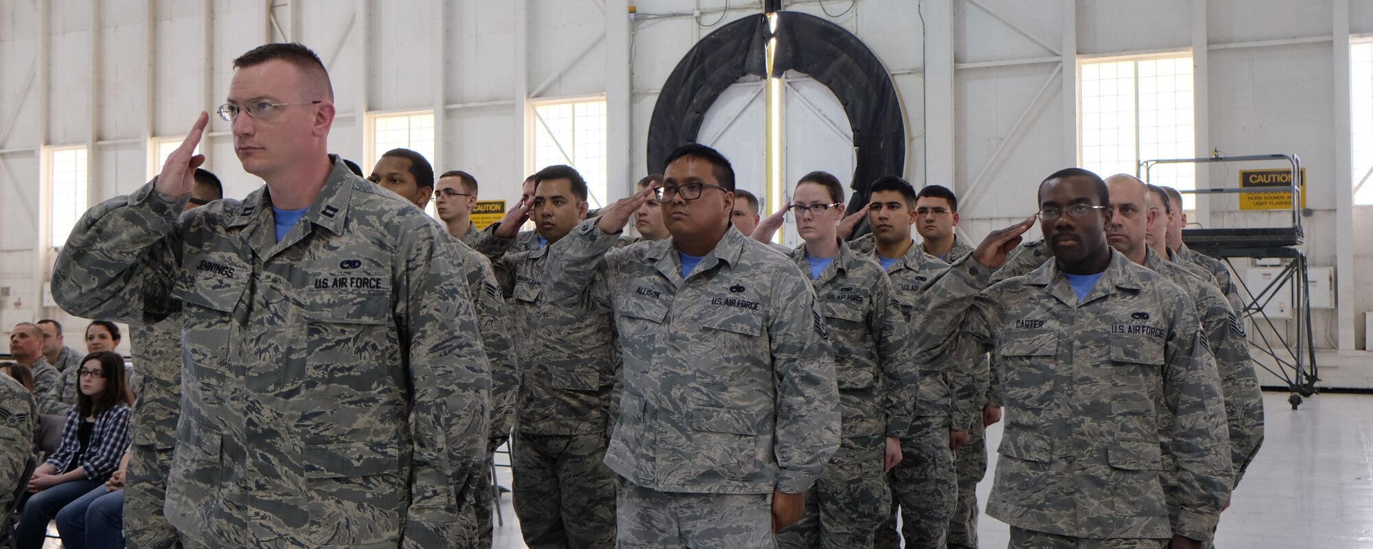 Members of the 931st Aircraft Maintenance Squadron salute their new commander, Lt. Col. Eric Eggers, during the 931 AMXS change of command ceremony March 6, 2016, McConnell Air Force Base, Kansas. This change of command ceremony, the first since the 931st Air Refueling Wing was redesignated from a group to a wing, follows a symbolic tradition representing the official transfer of authority from one commander to the next. (U.S. Air Force photo by Senior Airman Preston Webb)
