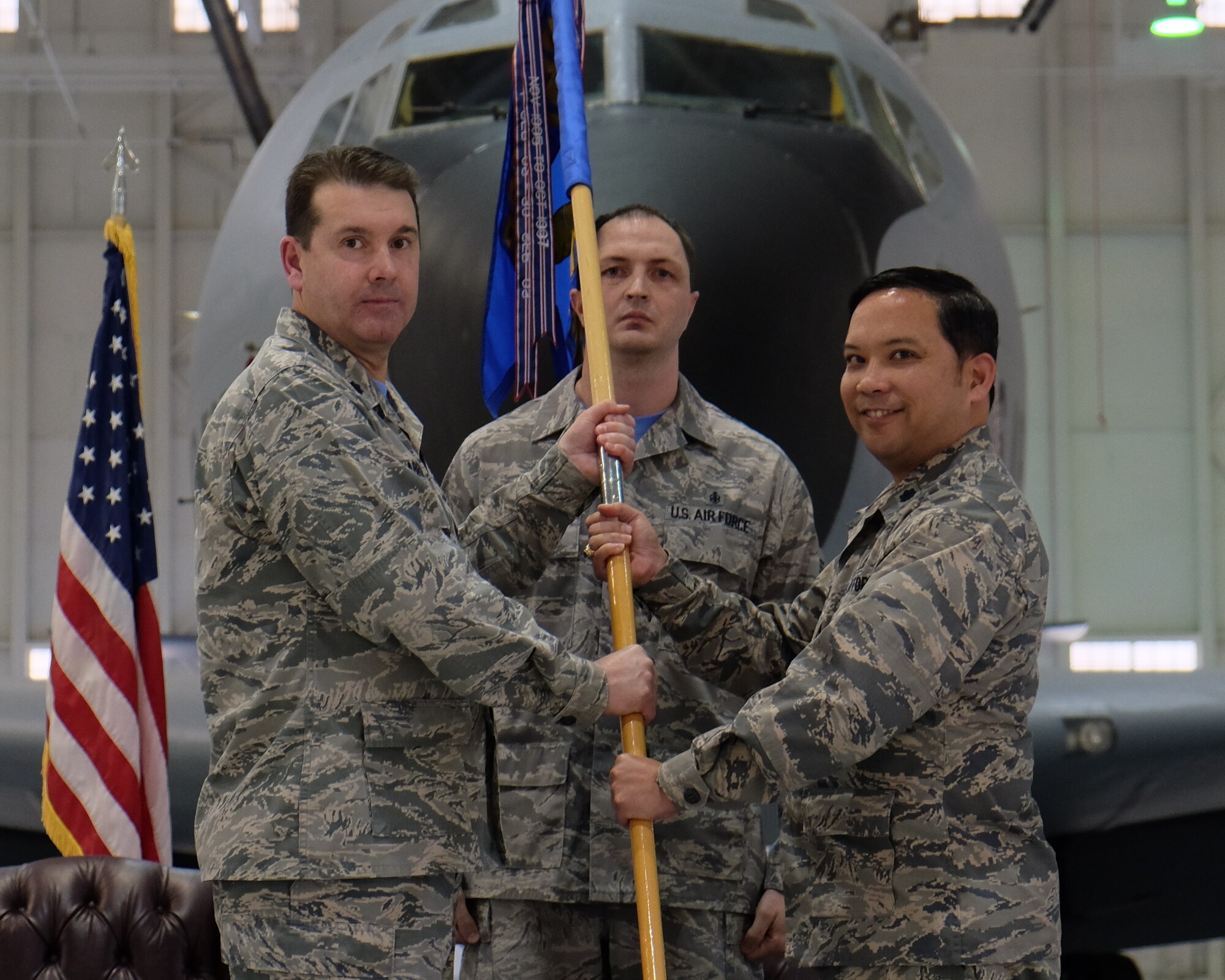 Lt. Col. Chris W. Labrum, left, 931st Air Refueling Wing deputy commander for maintenance,receives the 931st Aircraft Maintenance Squadron guidon from Lt. Col. Vincent E. Casquejo, outgoing 931 AMXS commander, during the 931 AMXS change of command ceremony March 6, 2016, McConnell Air Force Base, Kansas. As 931 AMXS commander, Casquejo oversaw 166 conducting on-equipment maintenance on 63 KC-135 aircraft valued at $2.5 billion. (U.S. Air Force photo by Senior Airman Preston Webb)