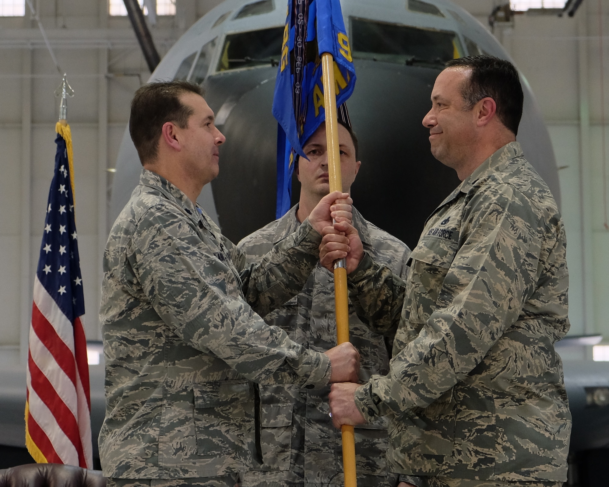 Lt. Col. Chris W. Labrum, left, 931st Air Refueling Wing deputy commander for maintenance, passes the 931st Aircraft Maintenance Squadron guidon to Lt. Col. Eric Eggers, incoming 931 AMXS commander, during the 931 AMXS change of command ceremony March 6, 2016, McConnell Air Force Base, Kansas. This is first change of command since the 931 ARW was redesignated from a group to a wing. (U.S. Air Force photo by Senior Airman Preston Webb)