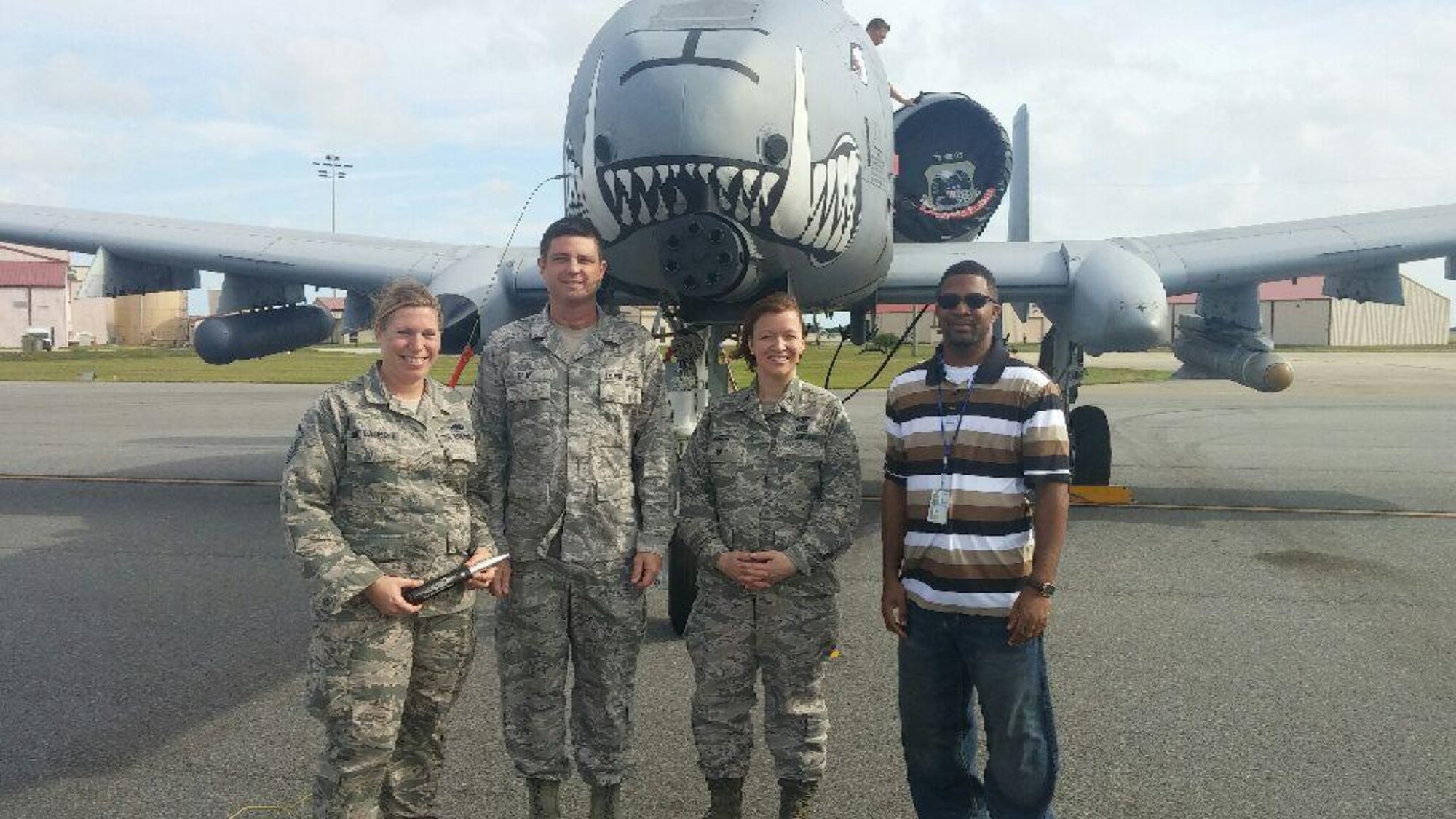 PATRICK AIR FORCE BASE, Fla. – (Left to right) Master Sgt. Michelle St. Laurent, 920th Communications Flight radio frequency transmission section chief, Senior Master Sgt. Timmy Gray, 920th CF superintendent, Col. Jeanne Bisesi, 920th Mission Support Group commander, and Mr. James Bailey, 920th CF network system administrator, stand in front of an A-10 Thunderbolt II aircraft, Feb. 4, here.  St. Laurent and Bailey were recognized for their responsiveness and outstanding communications support for the visiting A-10 Thunderbolt II crew.  (Courtesy photo)