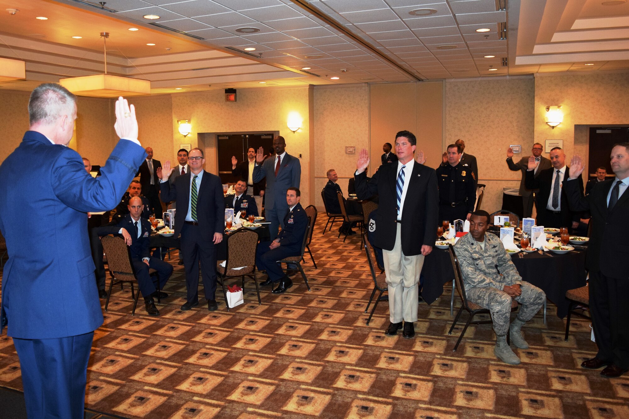 Col. David Scott, 433rd Airlift Wing vice commander, leads the new 433rd Airlift Wing honorary commanders in the honorary commander’s creed during an induction ceremony held in downtown San Antonio, Texas March 5,2016.  Of the 26 newly appointed honorary commanders for this year, 17 were on hand for the ceremony.  The ceremony, hosted by Col. Scott, is a time-honored tradition, signifying the important ties between the military and civilian communities. (U.S. Air Force photo/Tech. Sgt. Lindsey Maurice)