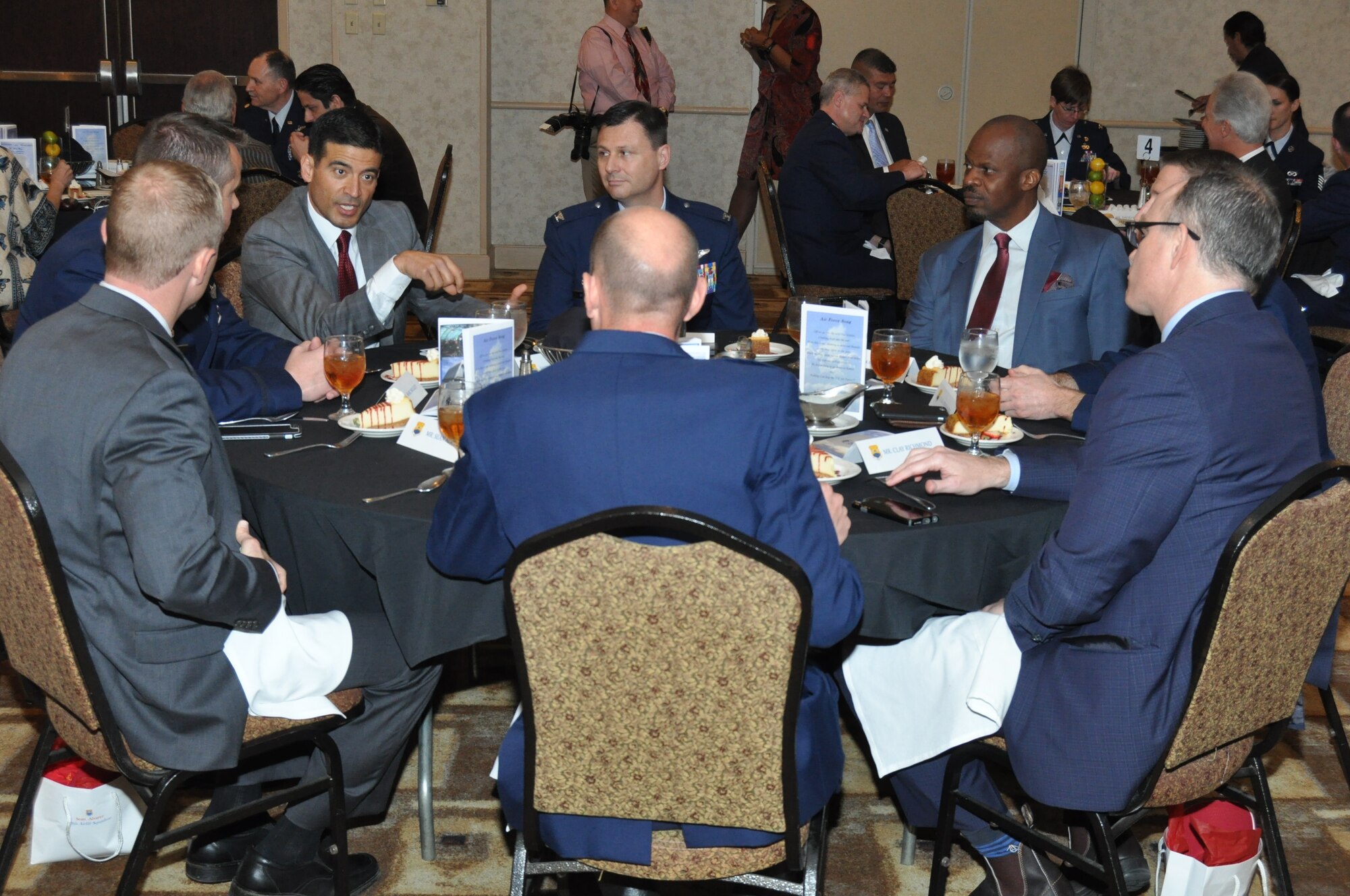 The Honorable Nicholas Nico LaHood, Bexar County Criminal District Attorney and new 433rd Operations Group honorary commander, talks with 433rd Airlift Wing leaders and other newly inducted honorary commanders during an induction ceremony held in downtown San Antonio, Texas March 5, 2016. The Honorary Commanders Program is an executive-level program intended as a forum in which the 433rd AW commander can solicit advice and support from civic leaders on matters affecting military and civilian communities, while cementing the already strong ties between the Alamo Wing and the San Antonio community. (U.S. Air Force photo/Senior Airman Bryan Swink)