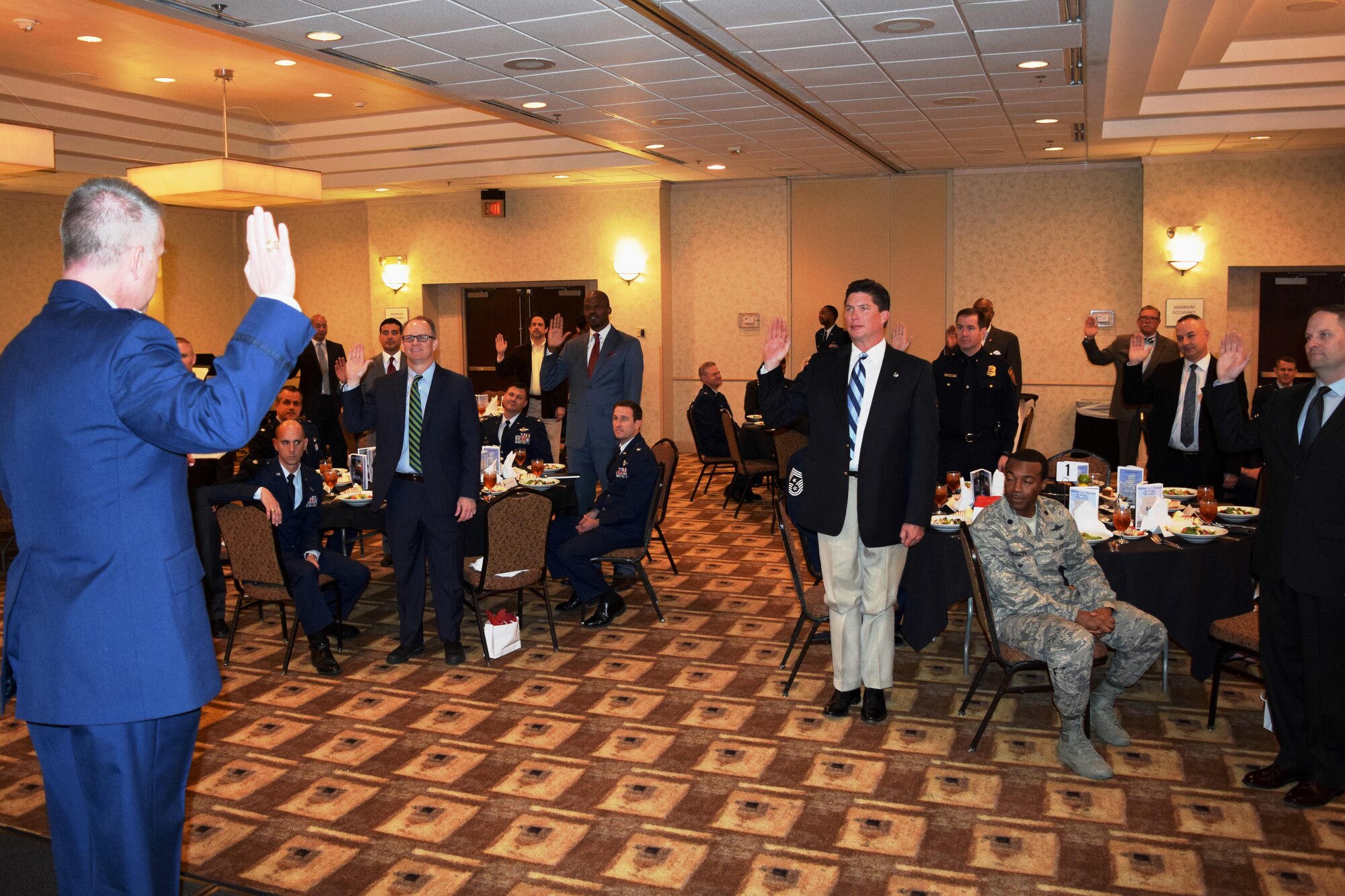 Col. David Scott, 433rd Airlift Wing vice commander, leads the new 433rd Airlift Wing honorary commanders in the honorary commander’s creed during an induction ceremony held in downtown San Antonio, Texas, March 5.  Of the 26 newly appointed honorary commanders for this year, 17 were on hand for the ceremony.  The ceremony is a time-honored tradition, signifying the important ties between the military and civilian communities. (U.S. Air Force photo/Tech. Sgt. Lindsey Maurice)