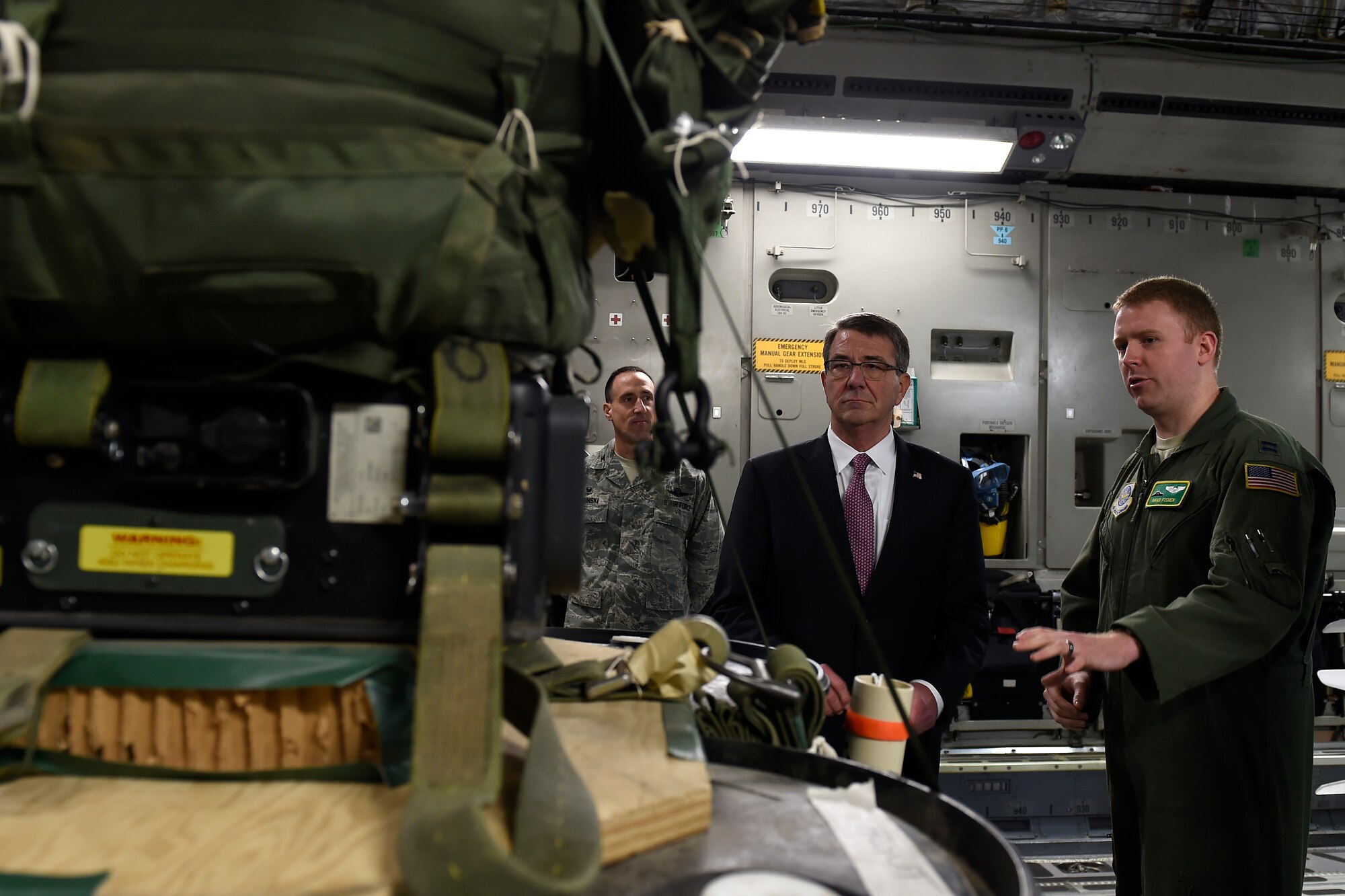 Capt. Brad Fisher (right), 62nd Airlift Wing C-17 Globemaster III pilot and executive officer, briefs Defense Secretary Ash Carter on C-17 Globemaster III air drop procedures March 4, 2016 at Joint Base Lewis-McChord, Wash. Air drop was one of four capabilities discussed with the secretary while was inside the C-17 static.  (U.S. Air Force photo/Tech. Sgt. Tim Chacon) 