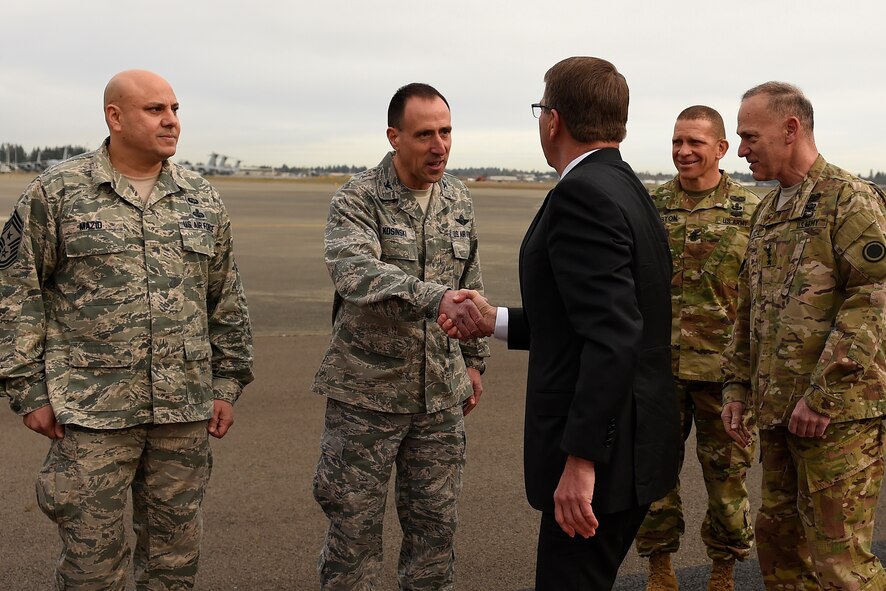 Defense Secretary Ash Carter is greeted by Joint Base Lewis-McChord leadership at McChord Field, Wash., March 4, 2016. As part of his one-day visit to JBLM, Carter had a chance to see static displays from both the U.S. Air Force and U.S. Army.  (U.S. Air Force photo/Tech. Sgt. Tim Chacon) 