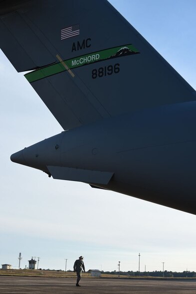 Staff Sgt. Arthur Mendoza, 62nd Aircraft Maintenance Squadron crew chief, checks the tail of a McChord Field C-17 Globemaster III during a pre-flight check on the flight line at Eglin Air Force Base, Fla., March 2, 2016. The McChord tail was on the Gulf Coast with its aircrew to participate in aircraft defense testing. (U.S. Air Force photo/Staff Sgt. Naomi Shipley)