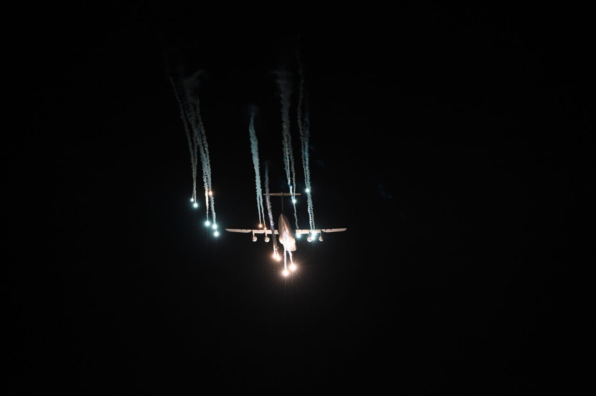 A C-5 aircraft from Travis Air Force Base, Calif., ejects flares over the Eglin Range March 2, 2016, at Eglin AFB, Fla. The C-5 aircraft was participating in Air Mobility Command flare effectiveness testing at Eglin along with a C-17 Globemaster III from the 62nd Airlift Wing out of Joint Base Lewis-McChord, Wash. Air Mobility Command Test and Evaluations Squadron conducted a month’s long test to provide AMC leadership with unbiased feedback in order for the command to make well-informed decisions regarding the aircraft defense systems. (U.S. Air Force photo/Staff Sgt. Naomi Shipley)