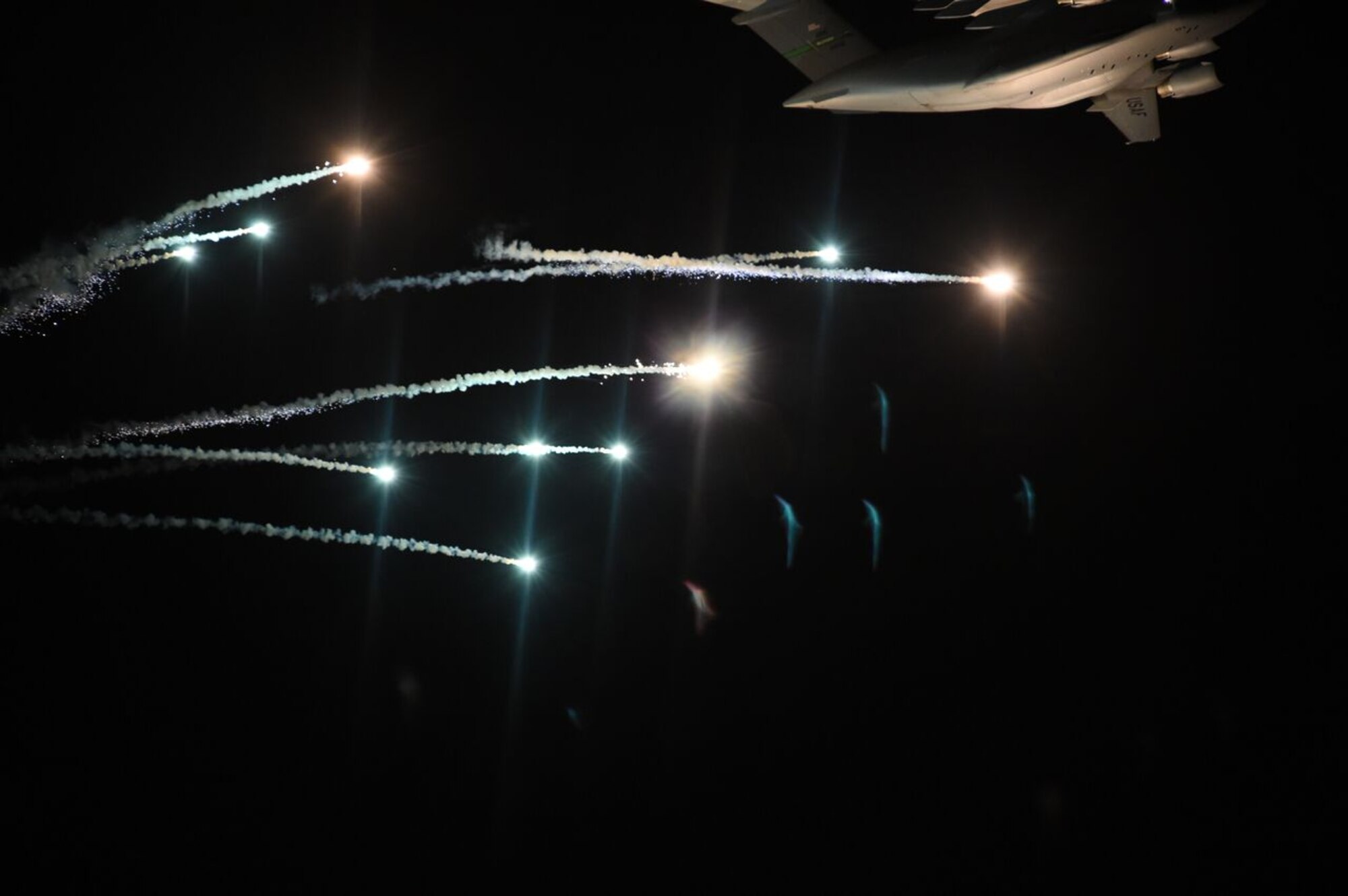 A C-17 Globemaster III from Joint Base Lewis-McChord, Wash., ejects flares over the Eglin Range March 2, 2016, at Eglin Air Force Base, Fla. The McChord Field C-17 was participating in Air Mobility Command flare effectiveness testing at Eglin AFB to ensure the infrared countermeasures are working as intended. (U.S. Air Force photo/Staff Sgt. Naomi Shipley) 
