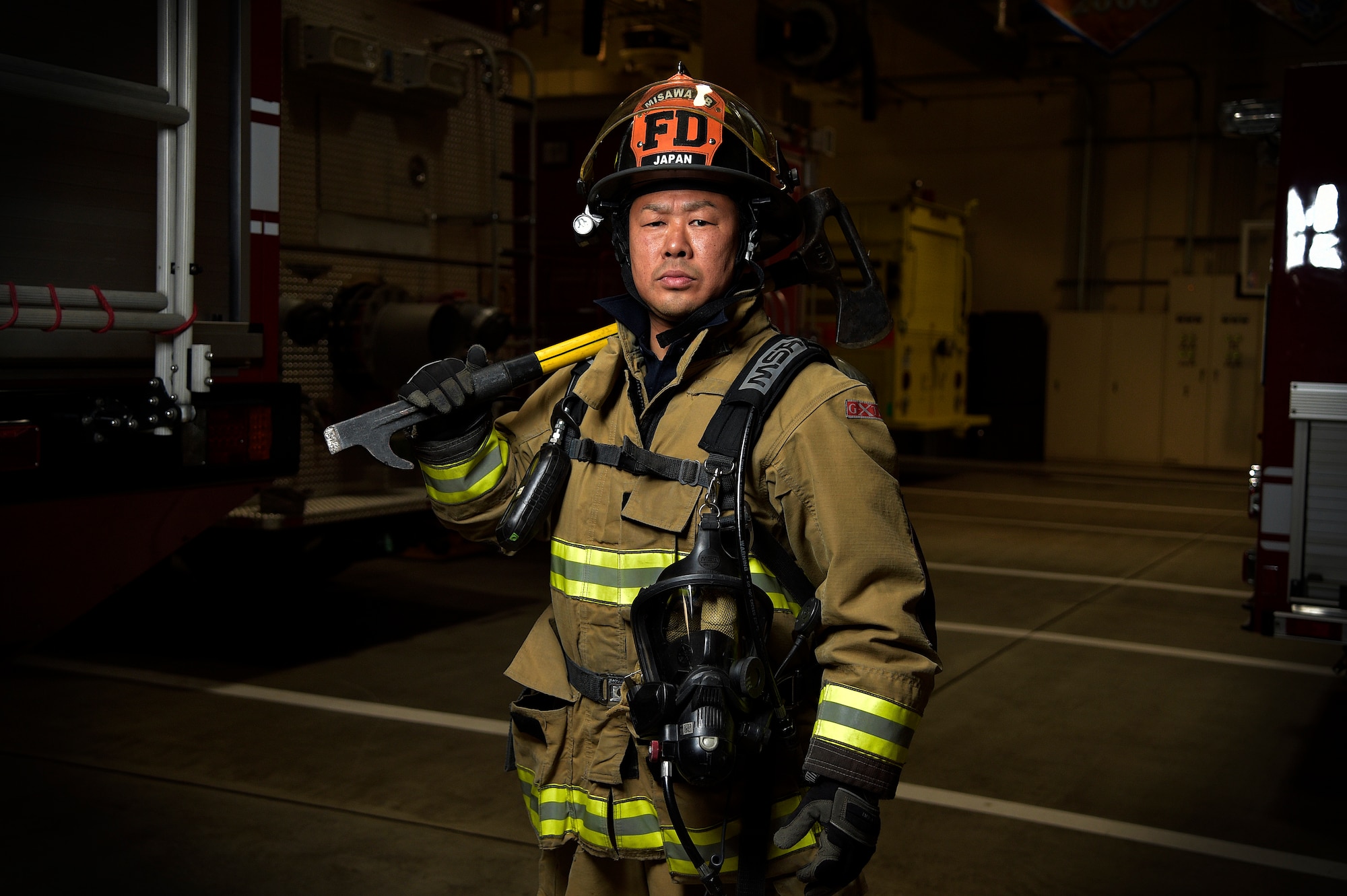 Takuya Kanto, a civilian firefighter with the 35th Civil Engineer Squadron, poses for a photo at Misawa Air Base, Japan, March 3, 2016. Kanto has been a MAB firefighter for over 20 years and frequently dedicates his time to visiting local villages that were affected by the 2011 Great East Japan earthquake and tsunami. Together with American military members, Kanto continues to strengthen the relationship between the U.S. and Japan by being an active member of the local community. (U.S. Air Force photo by Senior Airman Patrick S. Ciccarone) 